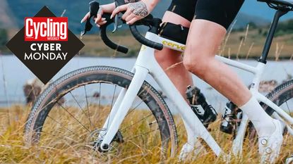 white and gold cervelo aspero gravel bike featuring tan wall tyre and female rider tackling some grassy singletrack