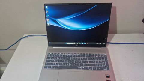 A silver HP Pavilion 16 sitting on a white desk