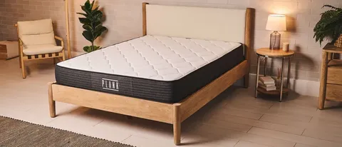 Plank mattress on a wooden frame in a bedroom