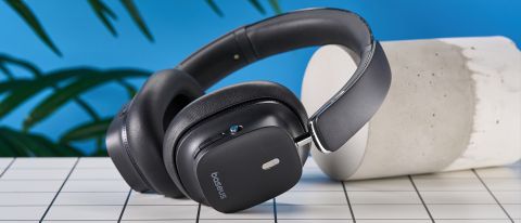 a pair of black baseus bowie 30 max headphones with soft rounded square cups with a blue background