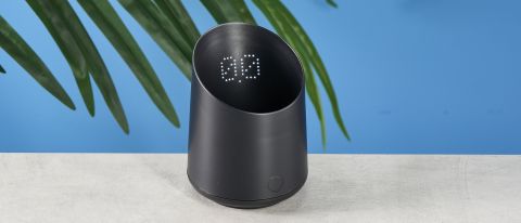 a black plastic coffee doser with an aesthetically pleasing design and a curved built-in LED screen