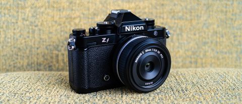 Nikon Z f camera on a vintage-style yellow chair