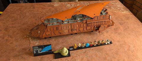 Lego Jabba&#039;s Sail Barge set and figures on a dusty desert mat