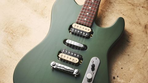 Godin Radium in green finish on a yellow background