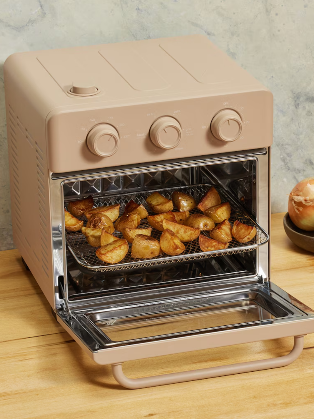 A creamy beige countertop Wonder Oven from Our Place