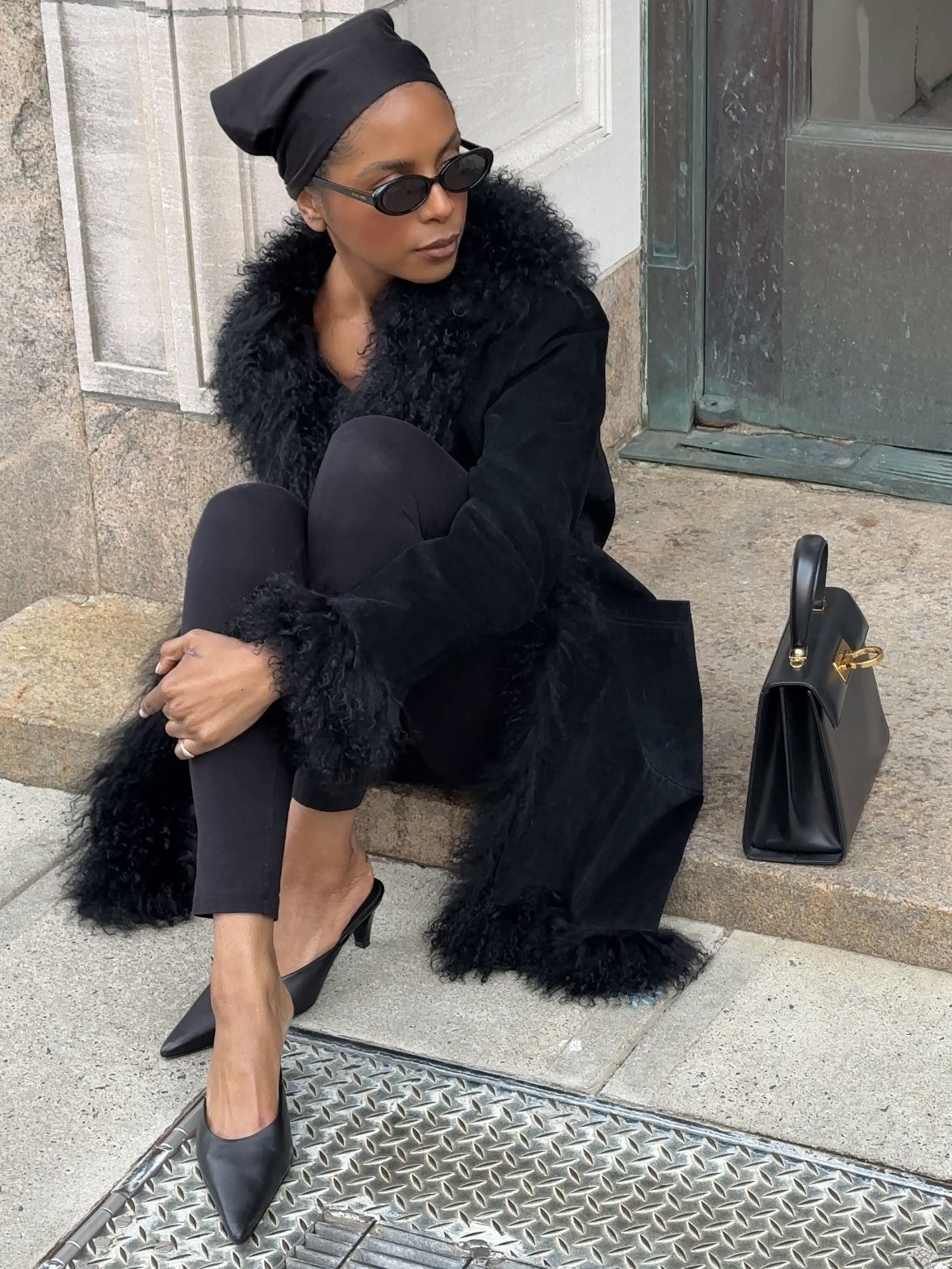 Maya Moore styles an all-black look with contrasting textures and pointed-toe mules