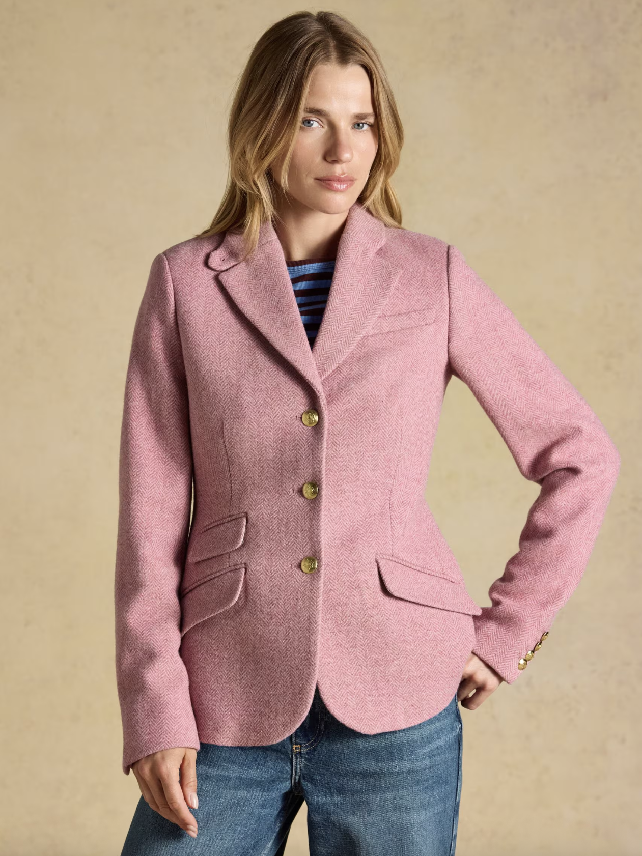 Woman wearing pink tweed blazer