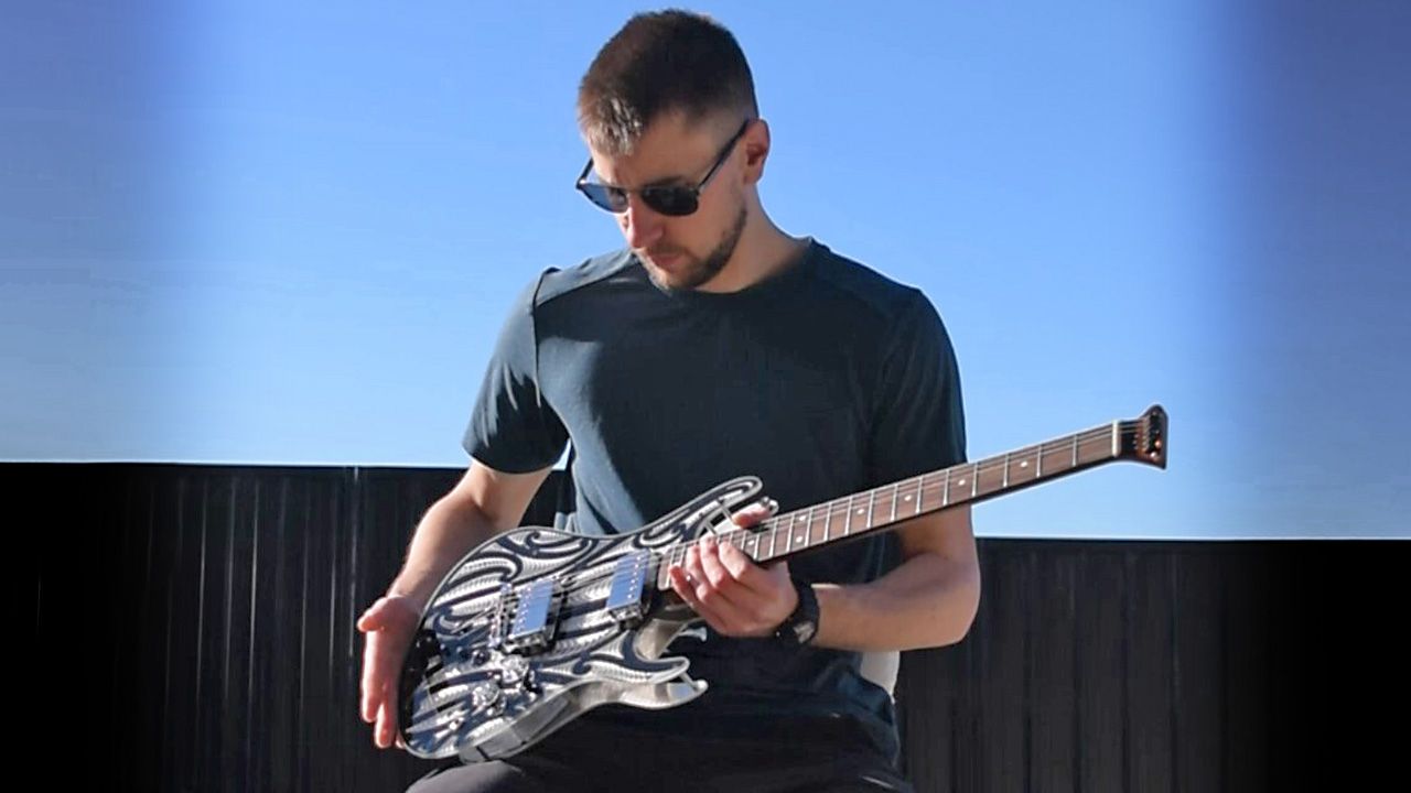 Dom Pearson with one of his guitars