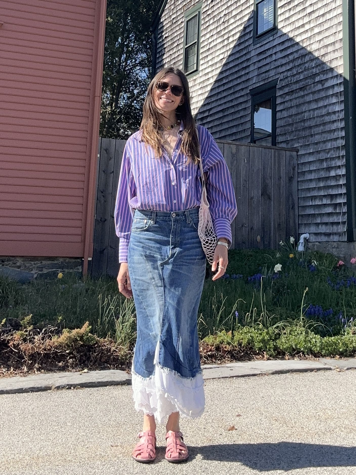 Julia Gall wears a "wildcard" denim skirt with a striped button-down and pink sandals