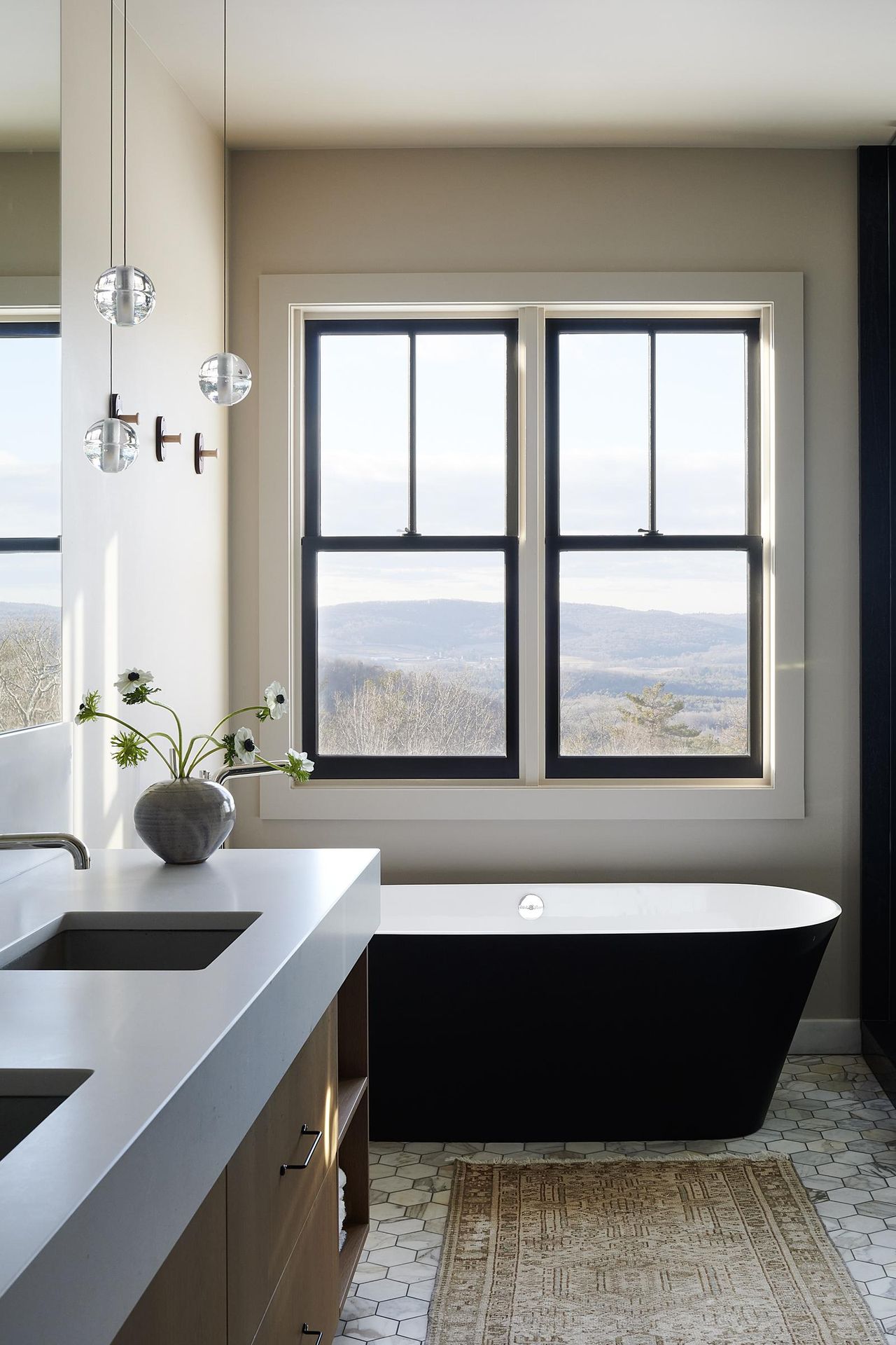 gray bathroom with black bath