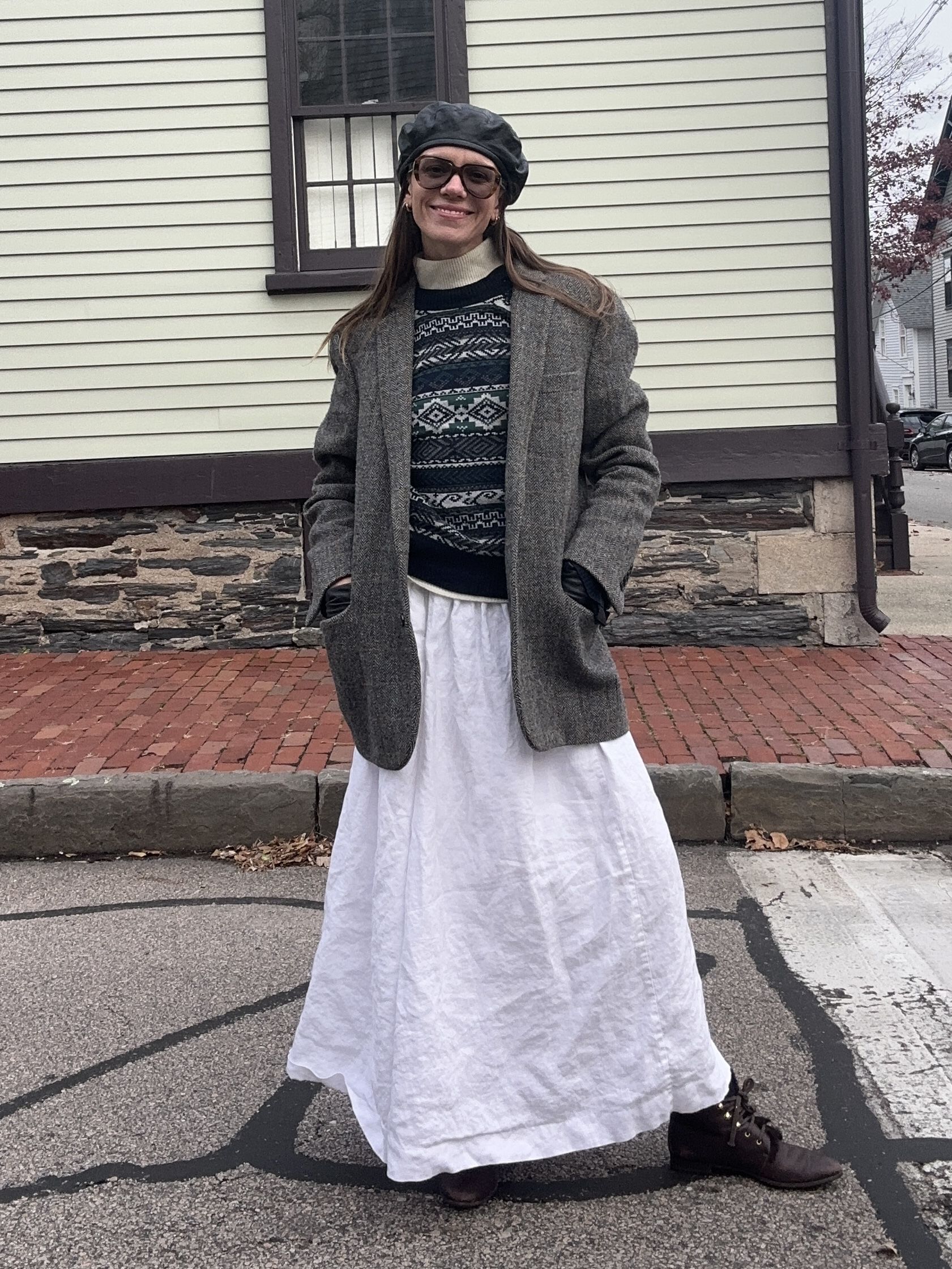 Julia Gall styles a long white skirt with warm fall layers