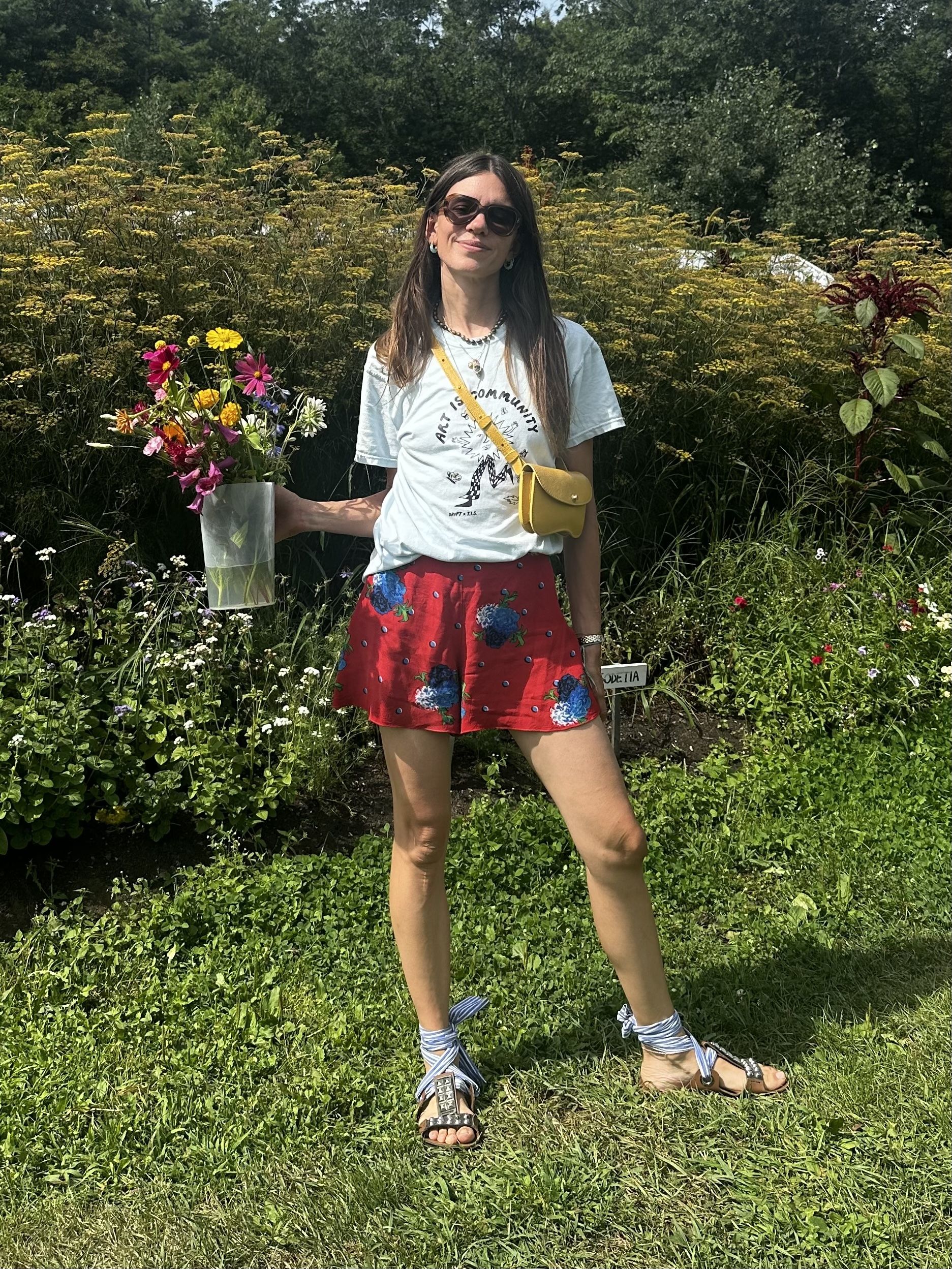 Julia Gall styles floral shorts with a graphic tee and elevated sandals