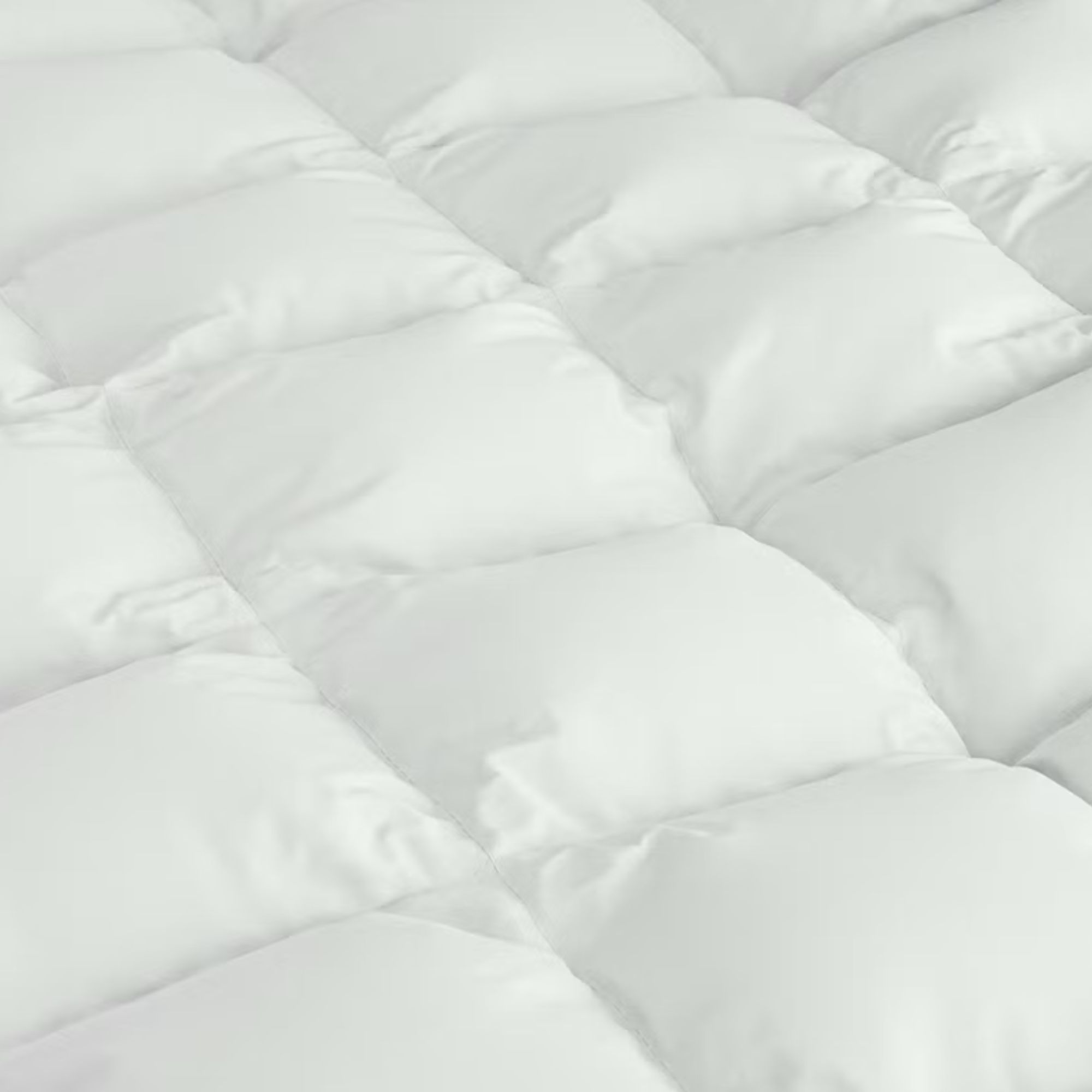 Saatva Down Alternative Comforter laid out flat