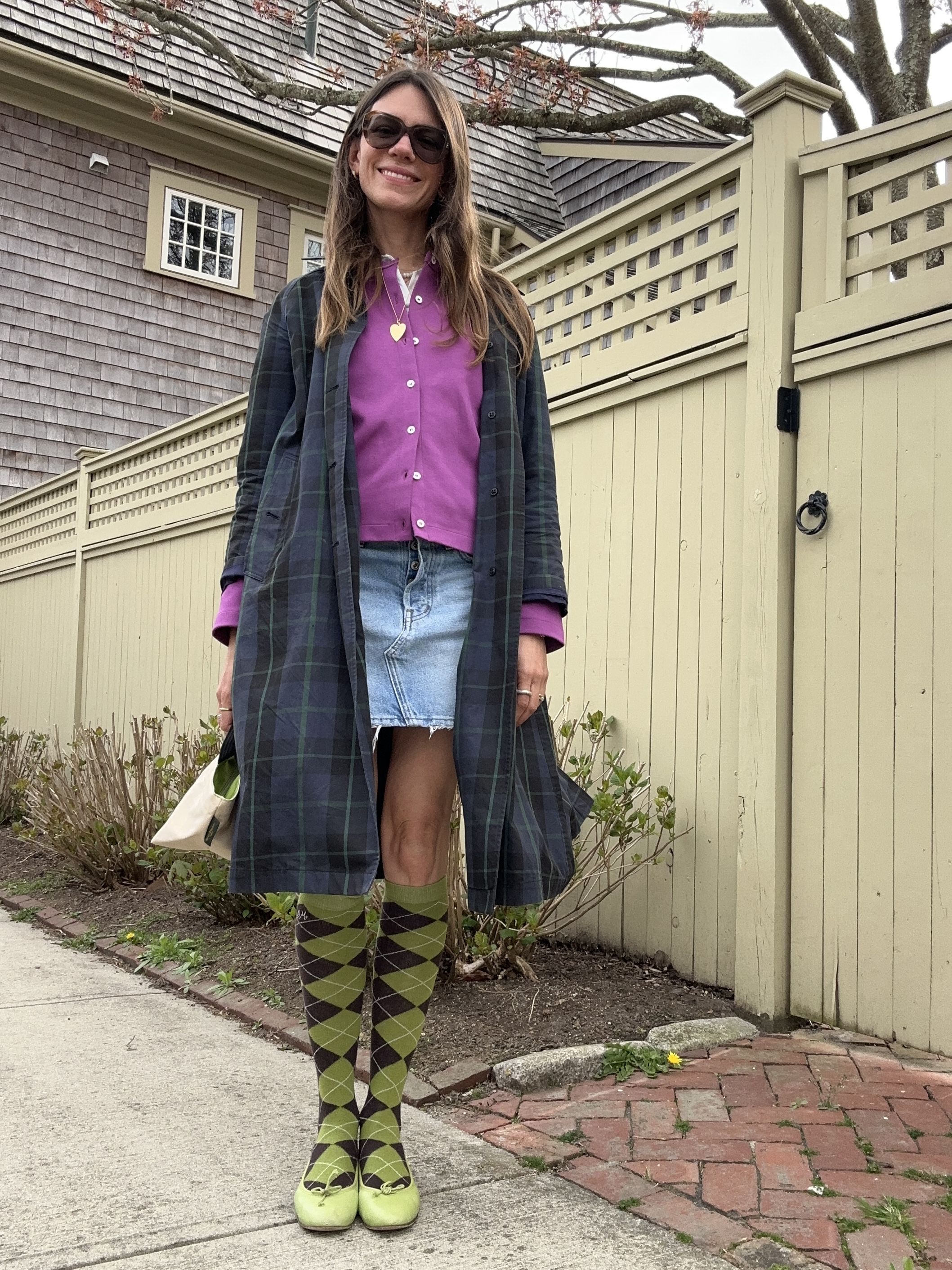 Julia Gall wears a short denim skirt with lime argyle knee socks and a purple cardigan