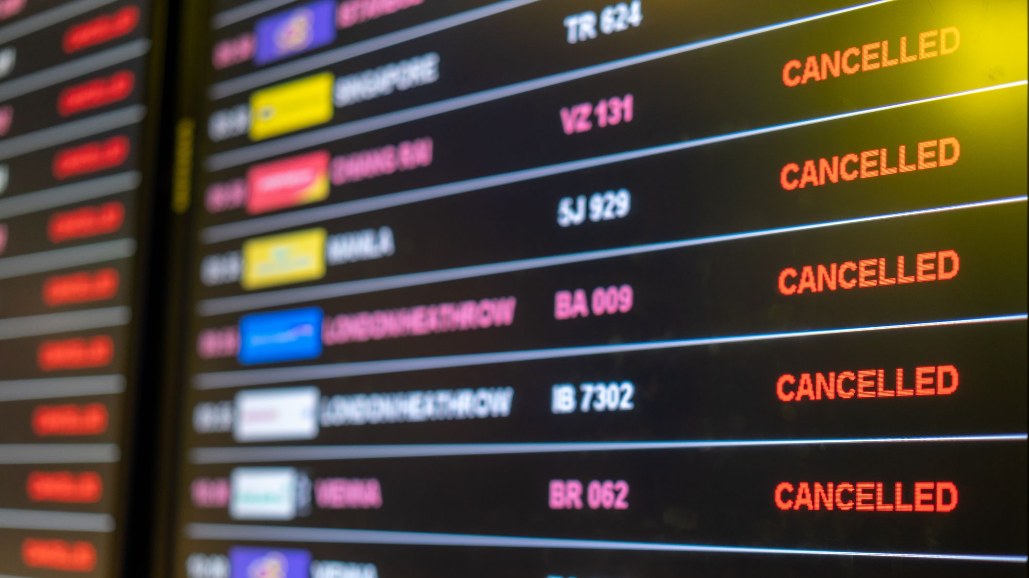 A board displaying multiple canceled flights.