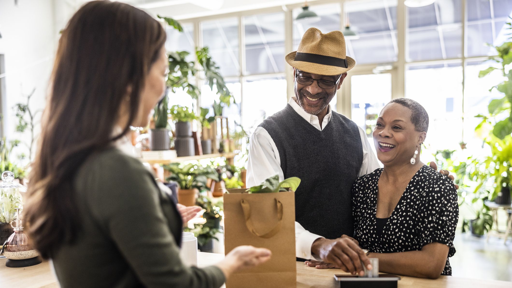 Happy couple shopping in the community
