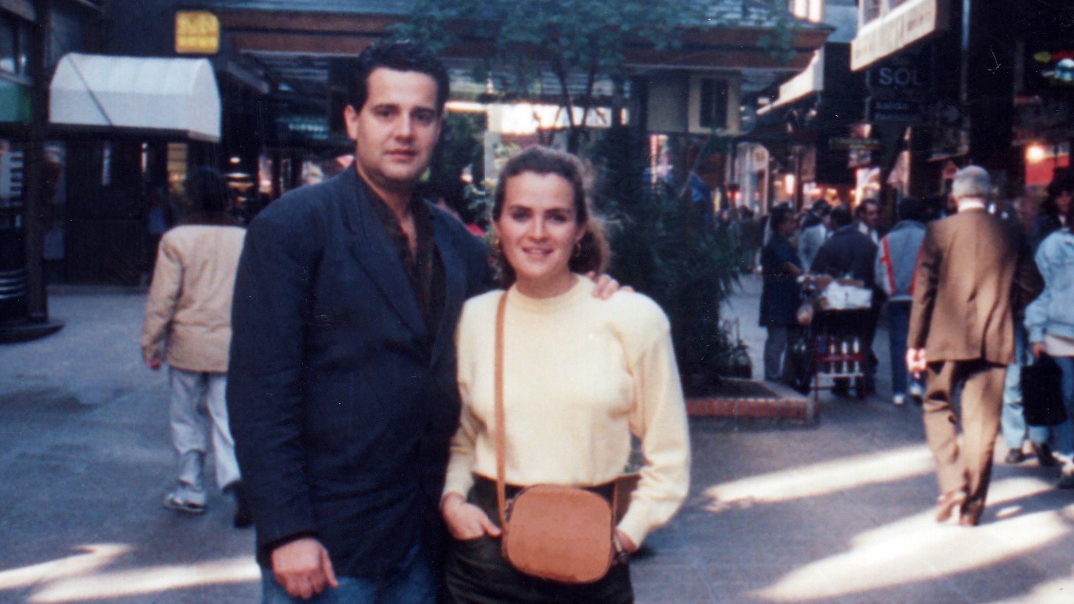A vintage photo of a college couple in the 1980s.
