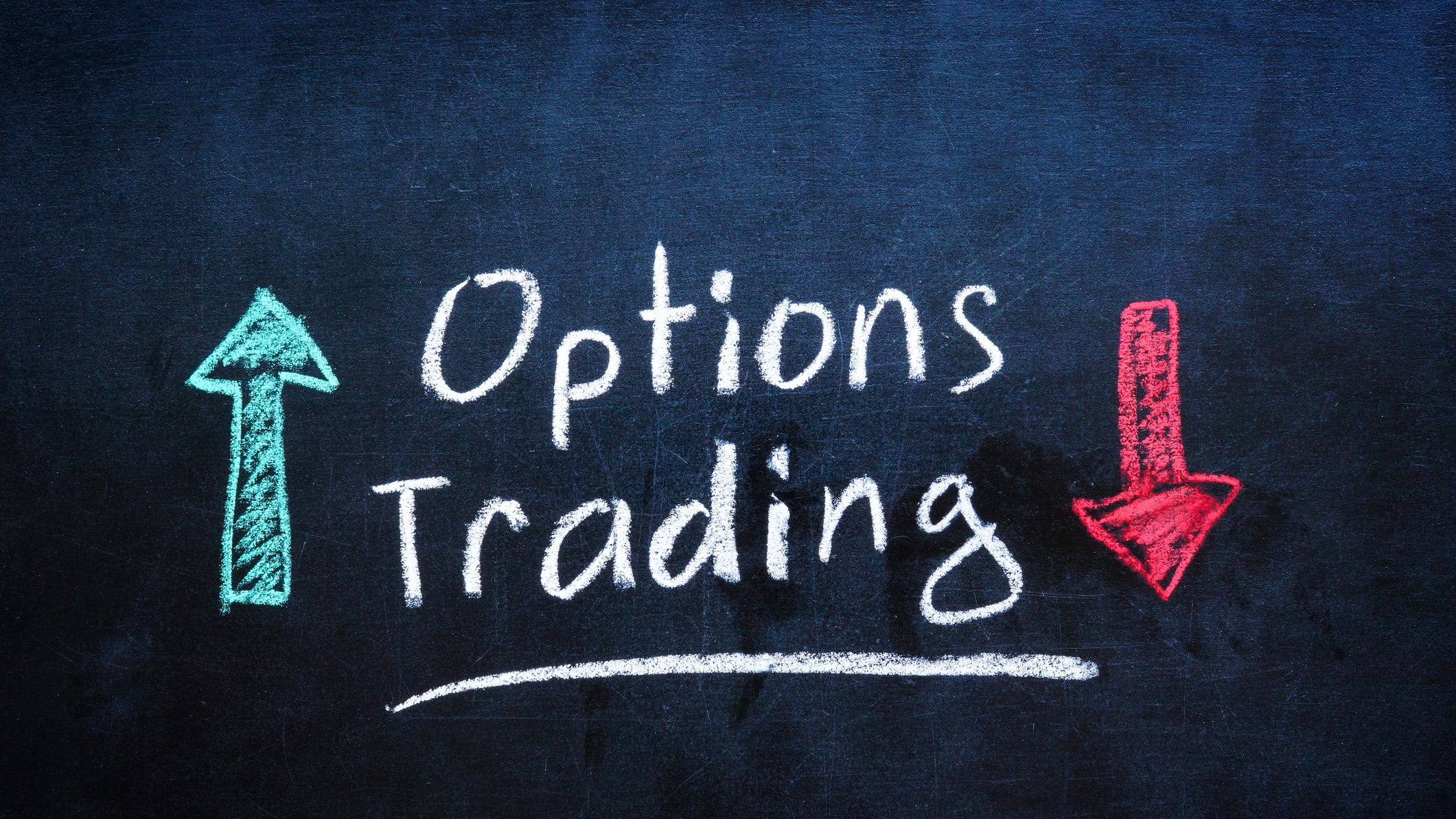 Chalkboard with options trading written in white chalk