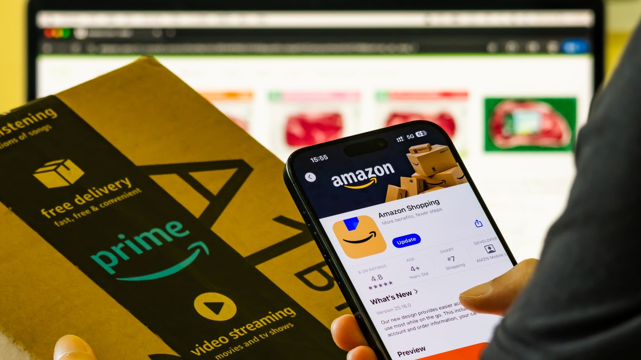 Amazon shopping app displayed on smartphone with Prime delivery box
