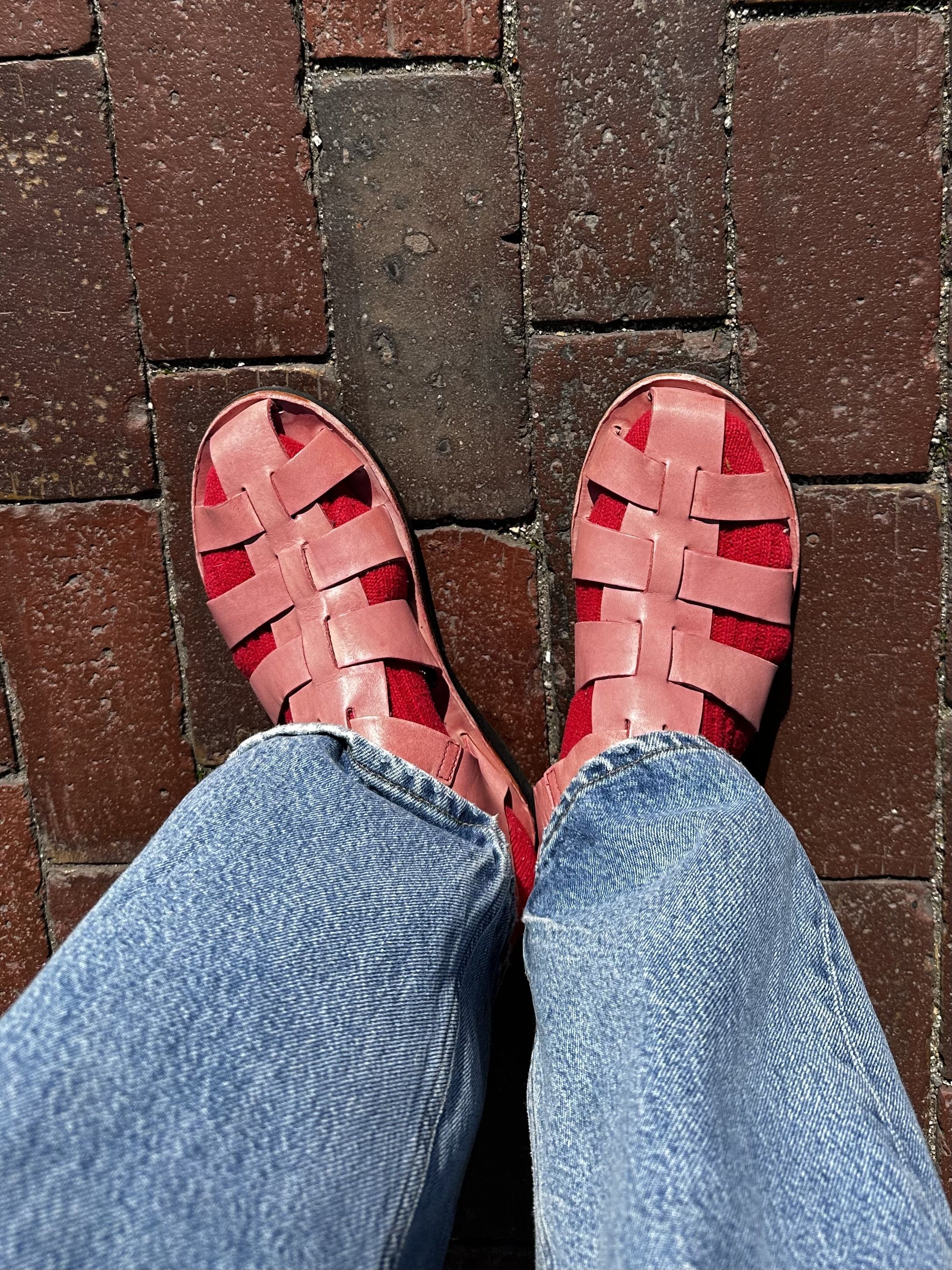 Julia Gall pairs colorful socks with earthy flat sandals