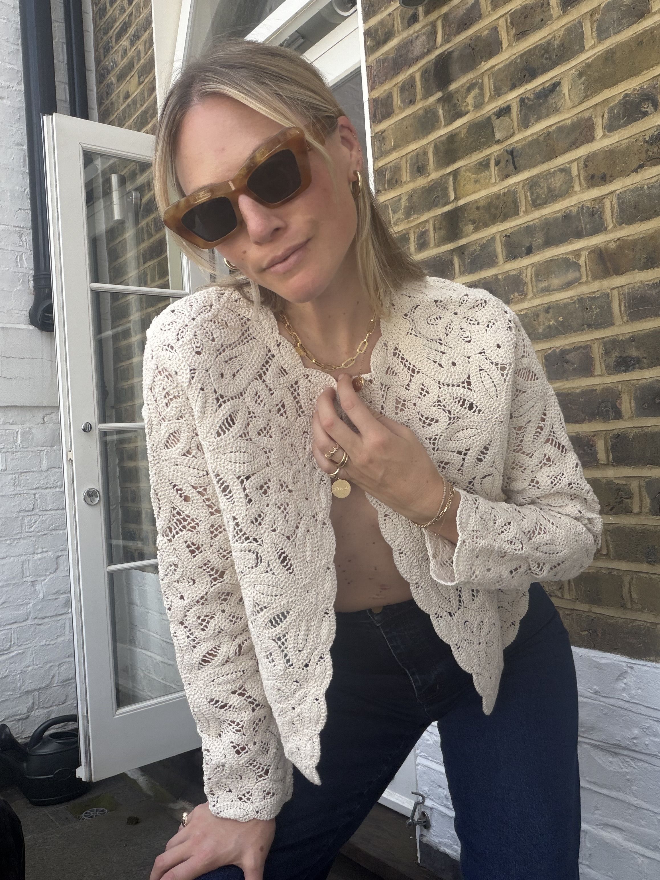 Brooke Ely Danielson wears a crochet jacket for summer with nothing underneath