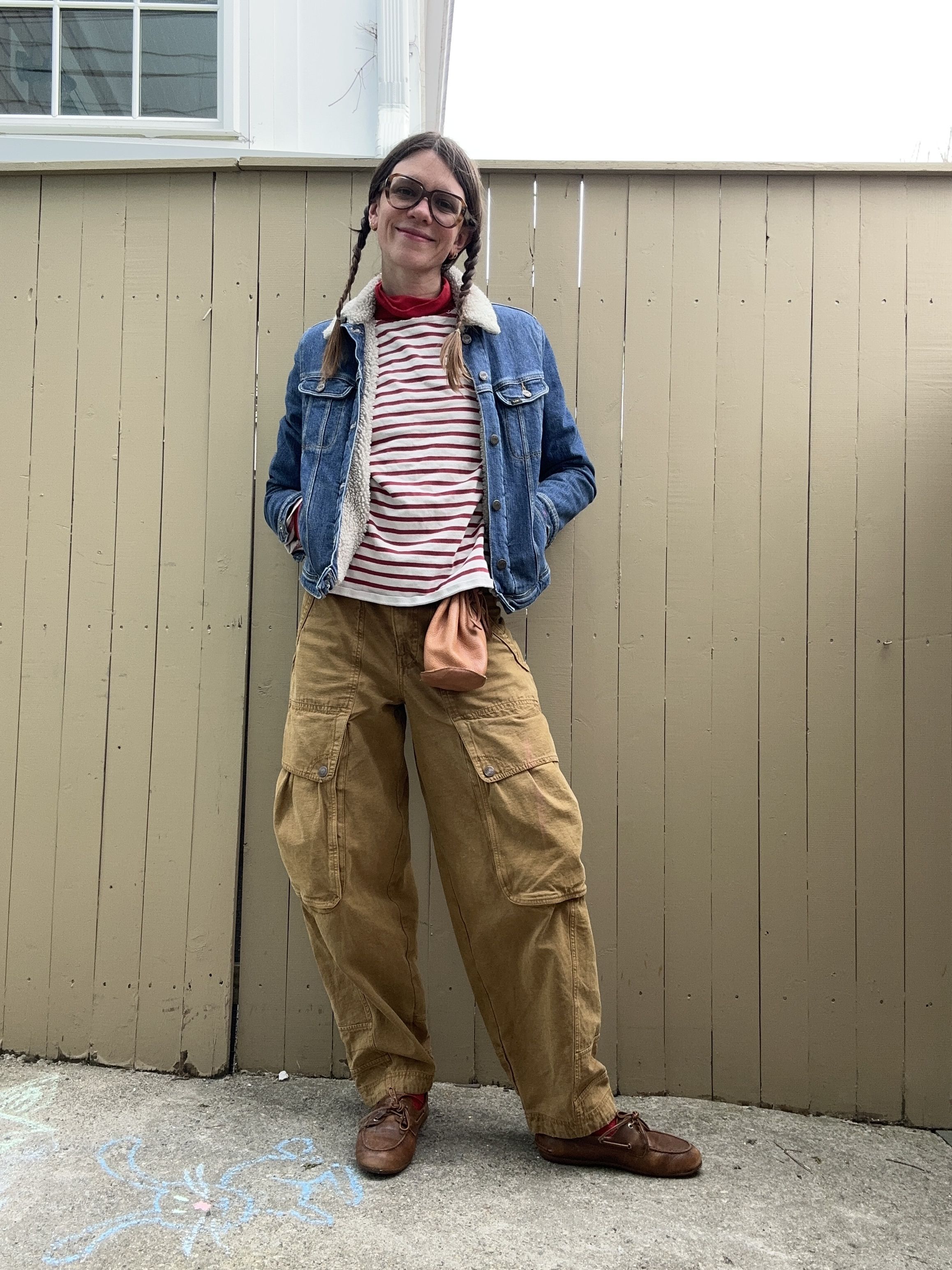 Julia Gall styles a drawstring pouch with cargo pants, a denim jacket and stripes