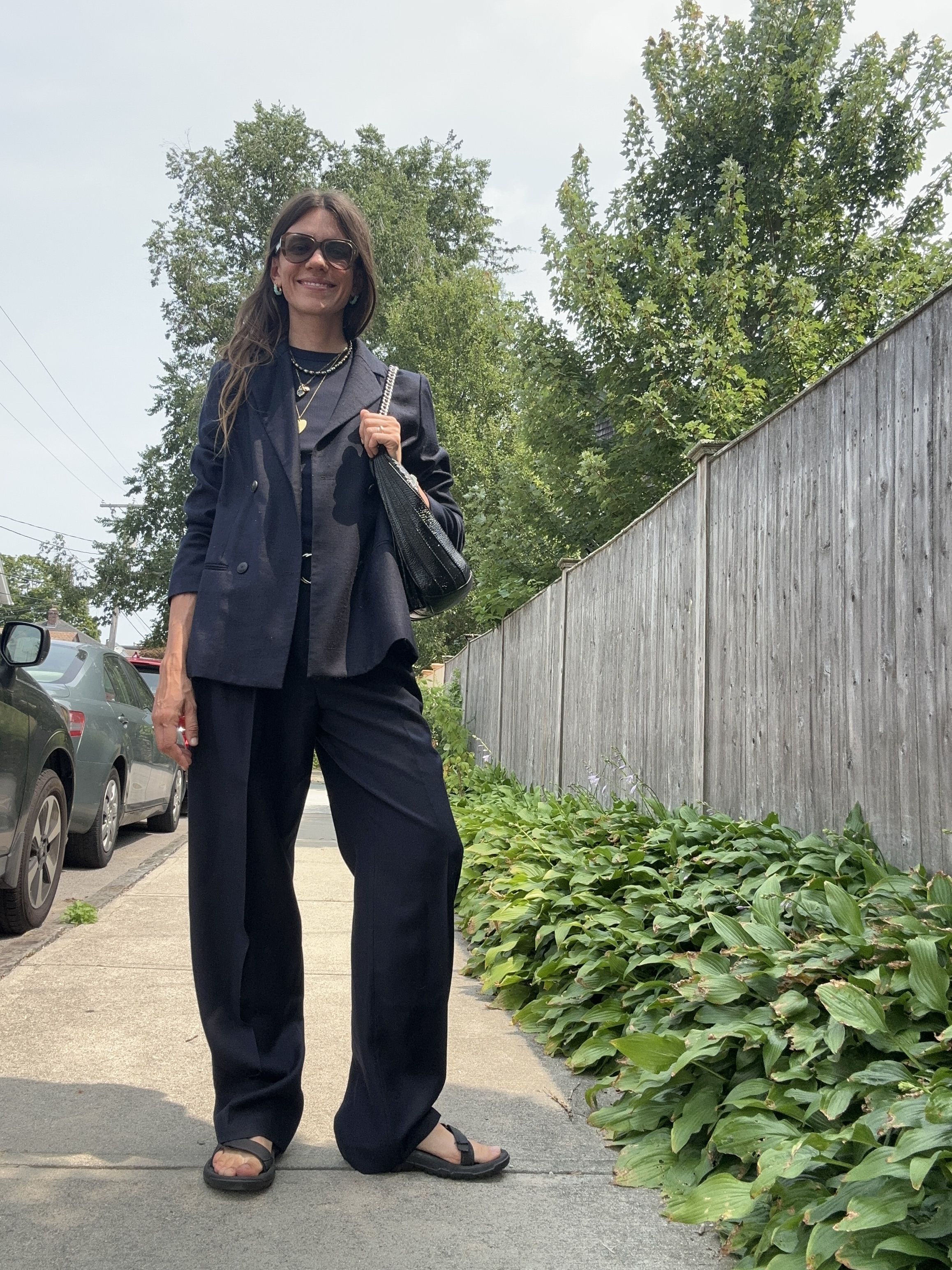 Julia Gall wears sporty sandals with streamlined suiting