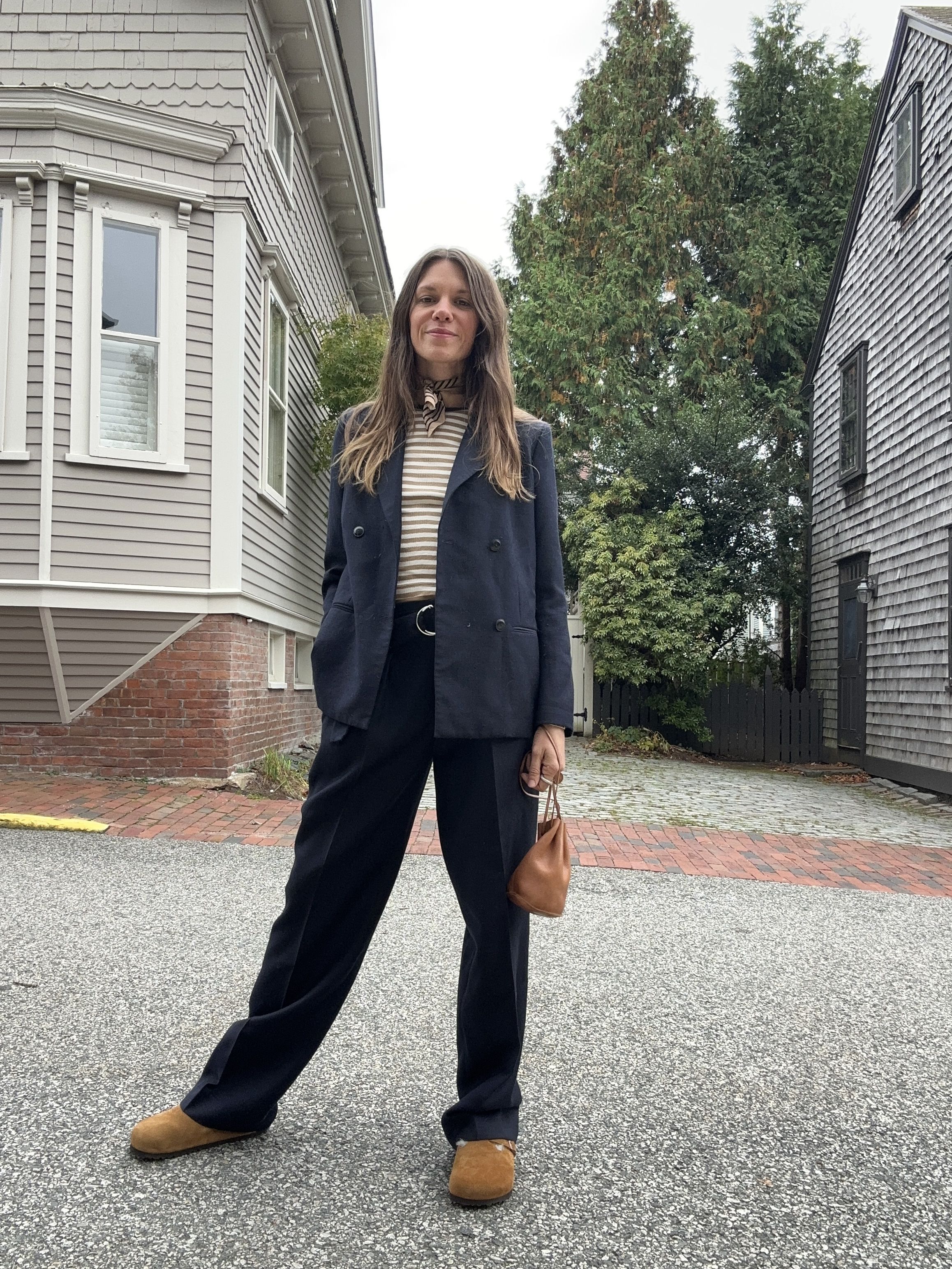 Julia Gall styles a leather drawstring pouch with a suit