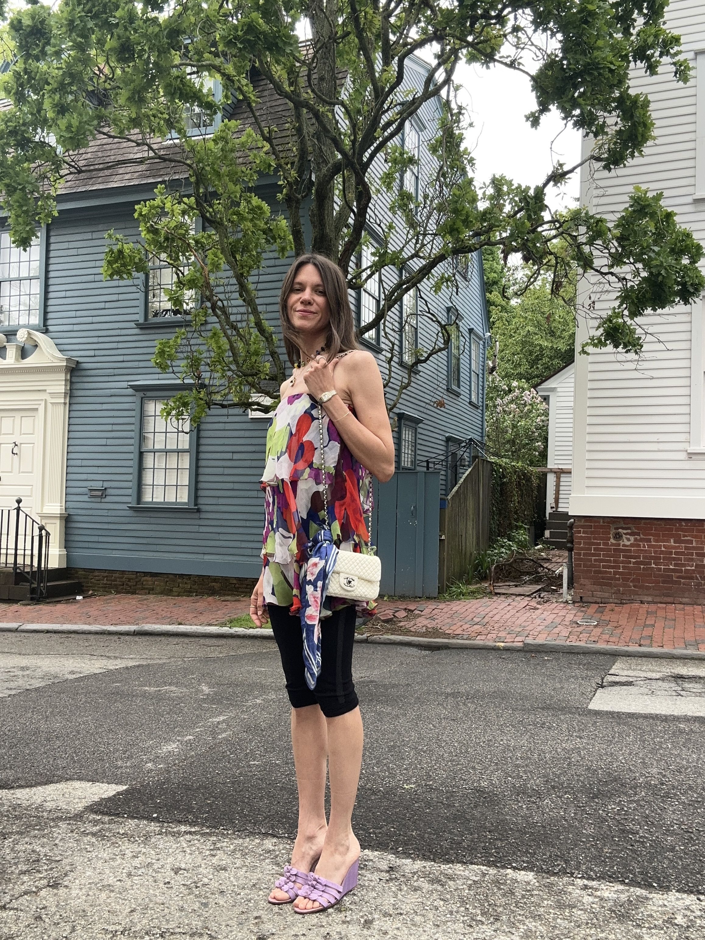 Julia Gall styles black capris with a bright patterned chiffon mini dress and purple wedges