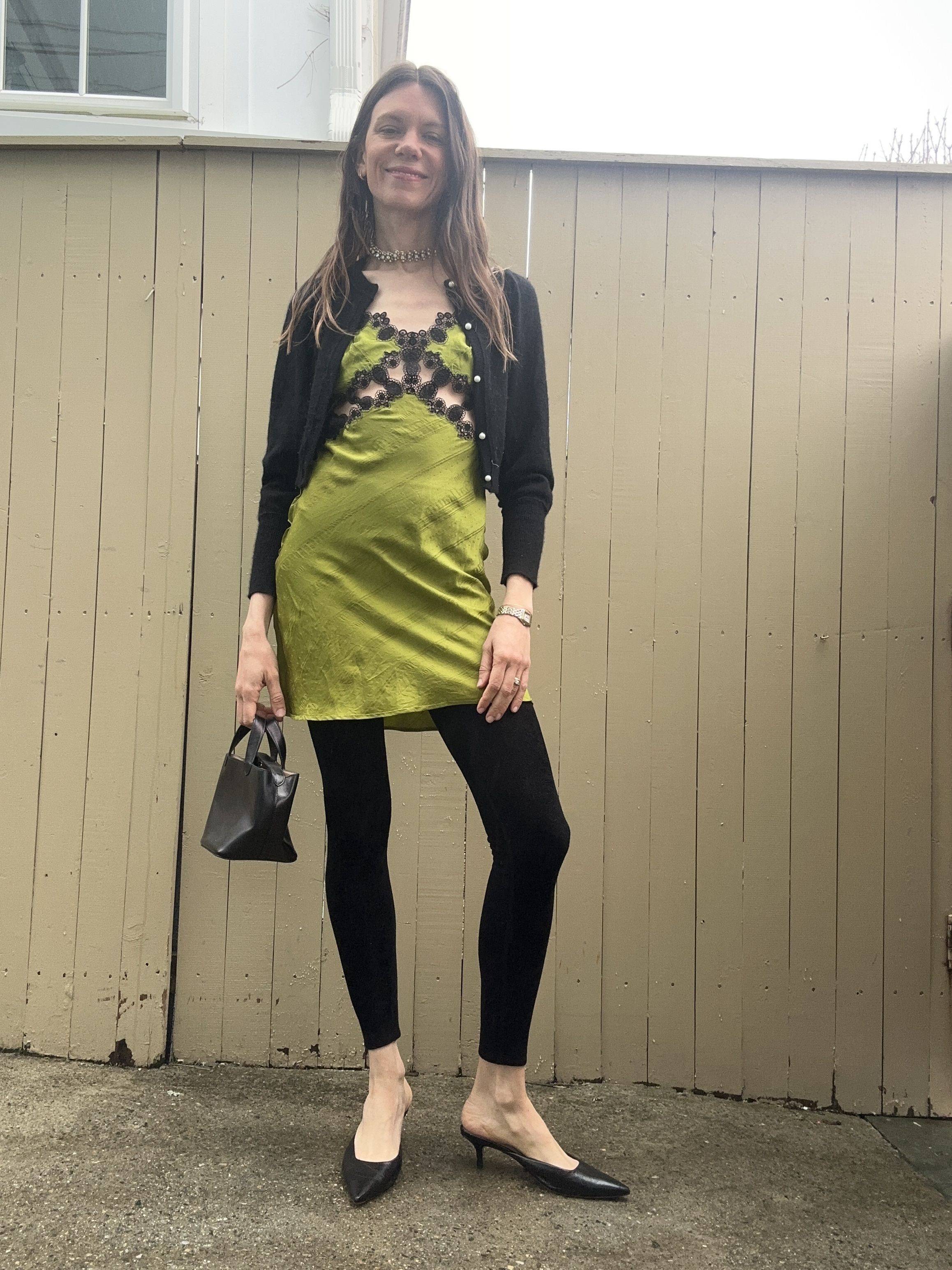 Julia Gall styles a green satin mini dress over black leggings