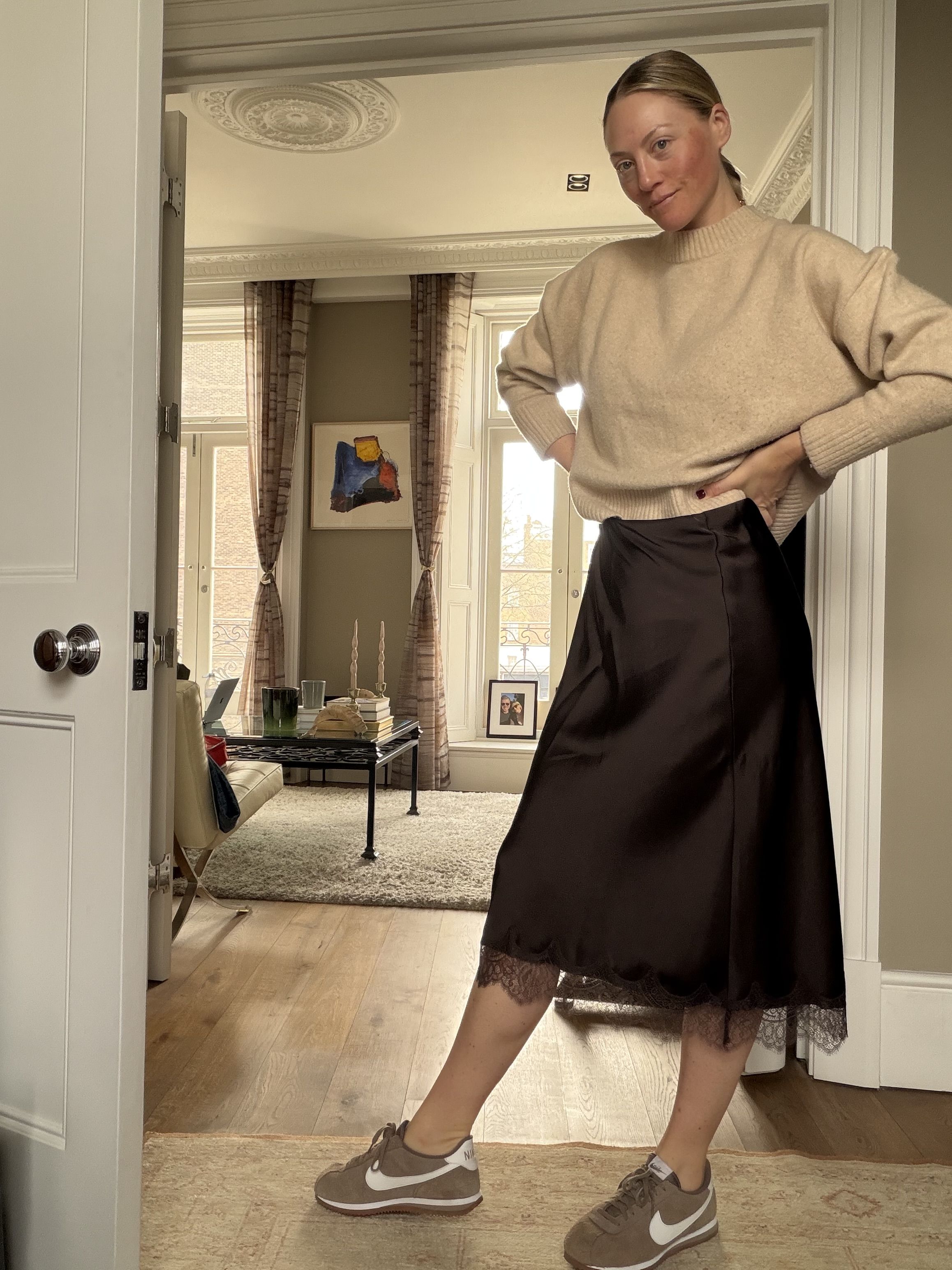 Brooke Ely Danielson styles her Nike Cortez with a crew neck and satin brown skirt