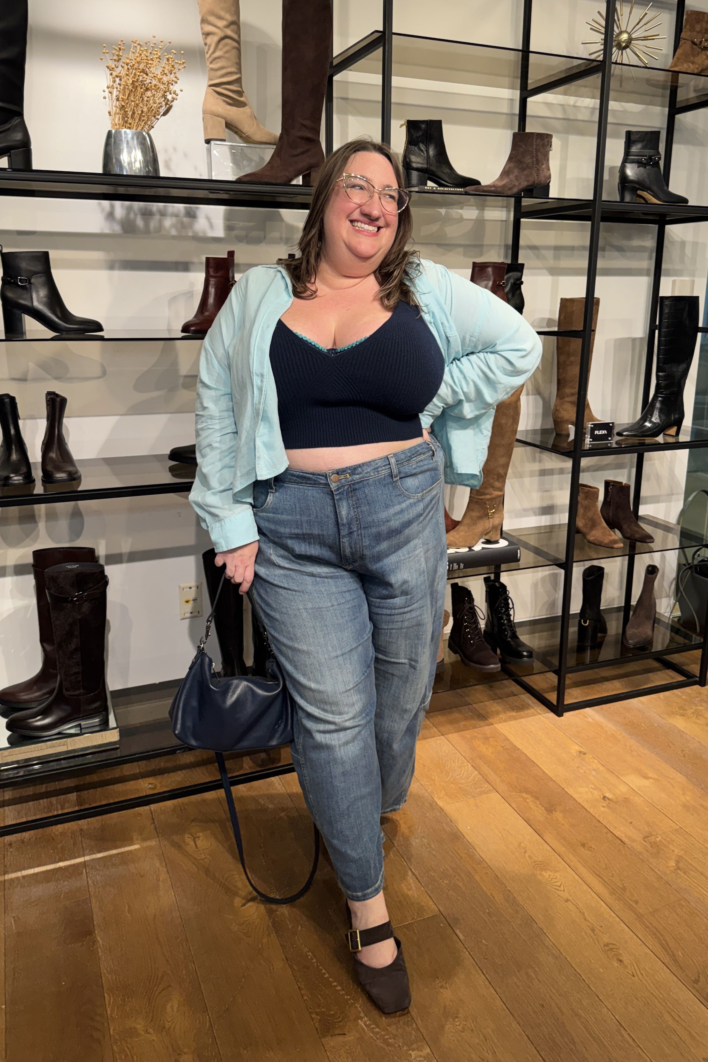 Sarah Chiwaya poses in Franco Sarto flats with jeans and a crop top