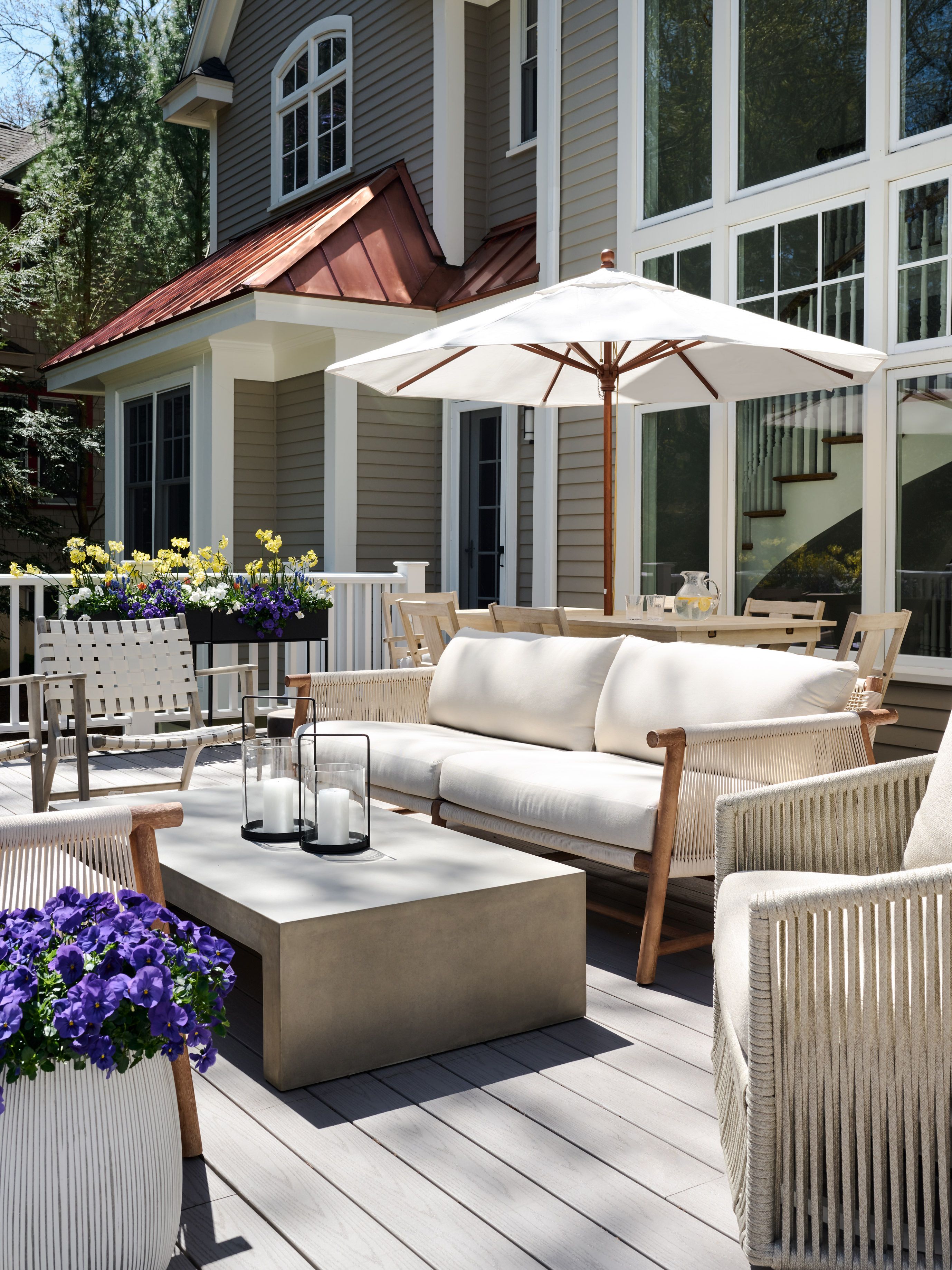 layered outdoor living room neutral furniture