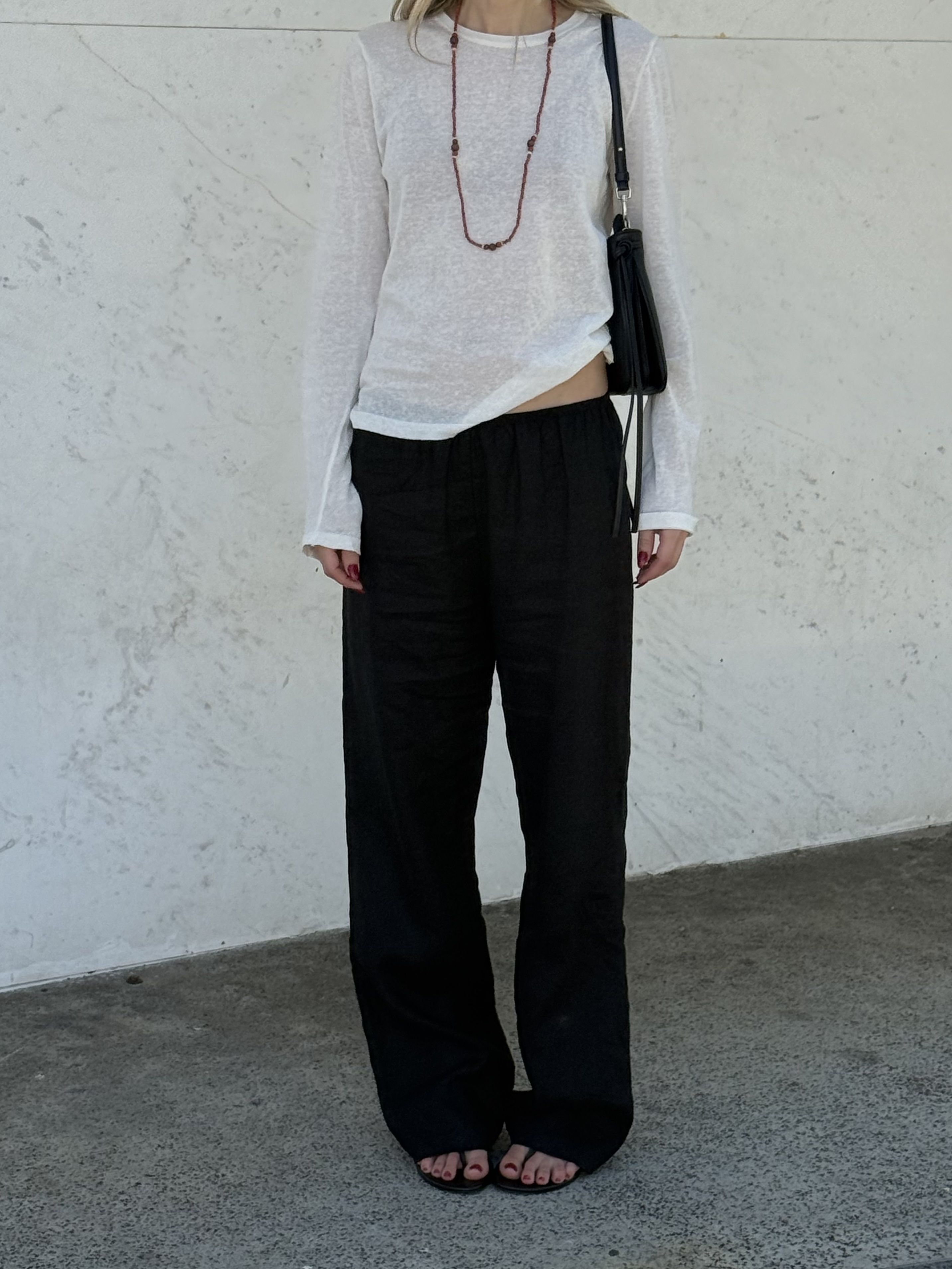 Angela Fink styles a long-sleeve over black linen pants