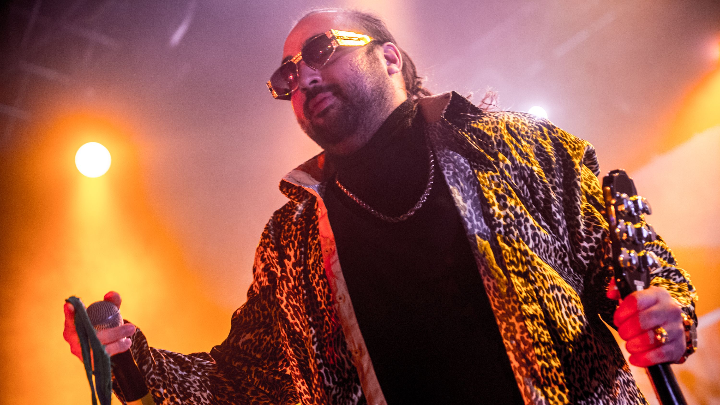 LONDON, ENGLAND - NOVEMBER 21: Asim Chaudhry performs in character as Chabuddy G of Kurupt FM from the BBC comedy "The People Just Do Nothing" onstage at O2 Forum Kentish Town during the People Just Do Nothing, Kurrupt FM Live Final (Probably) Tour on November 21, 2018 in London, England. (Photo by Ollie Millington/Redferns)