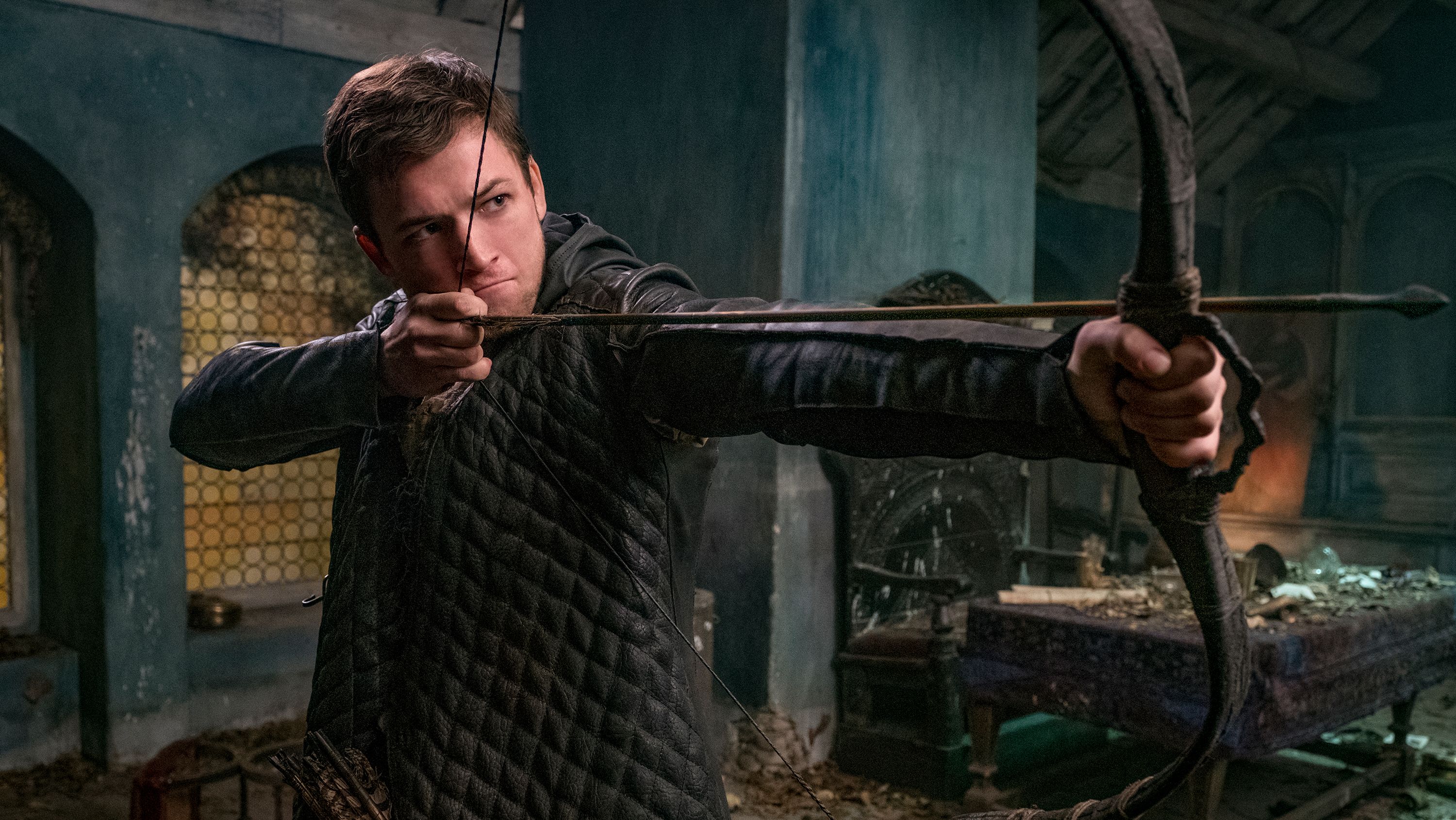 A man holds a bow and arrow in the Robin Hood TV shows
