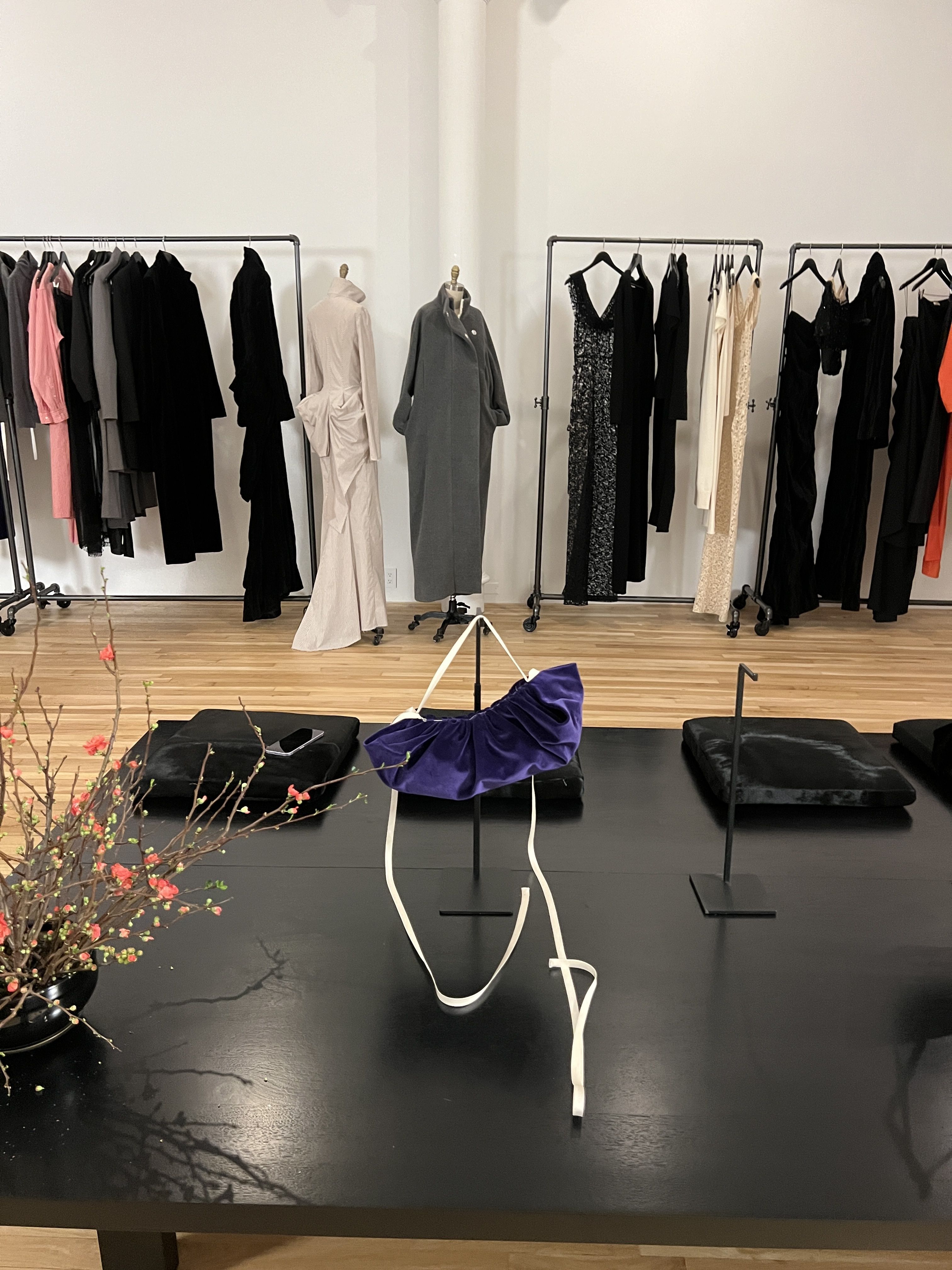 a photo from a Colleen Allen boutique featuring clothes on rails