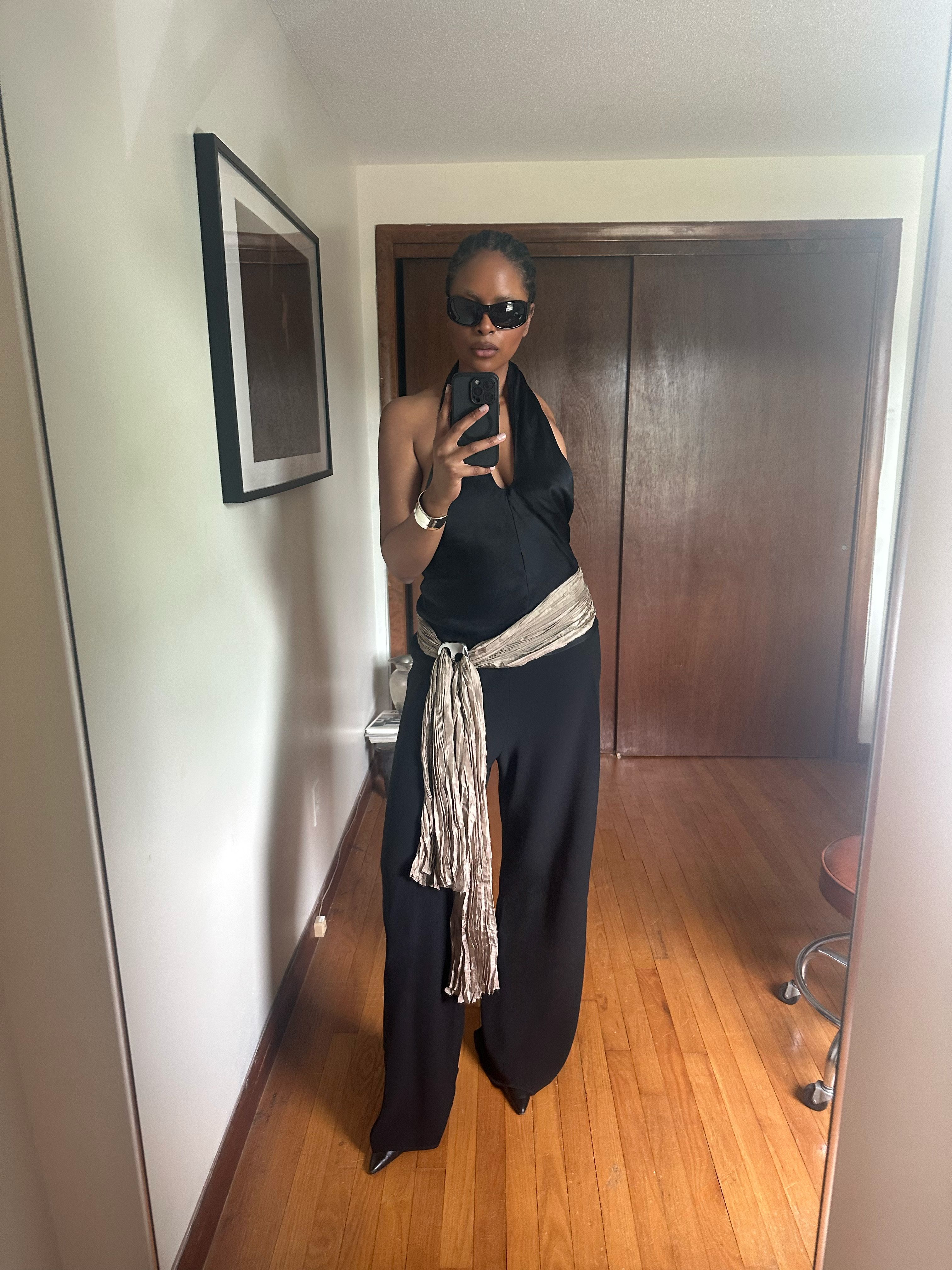 Maya Moore wears a black outfit with a silver tie around the hips