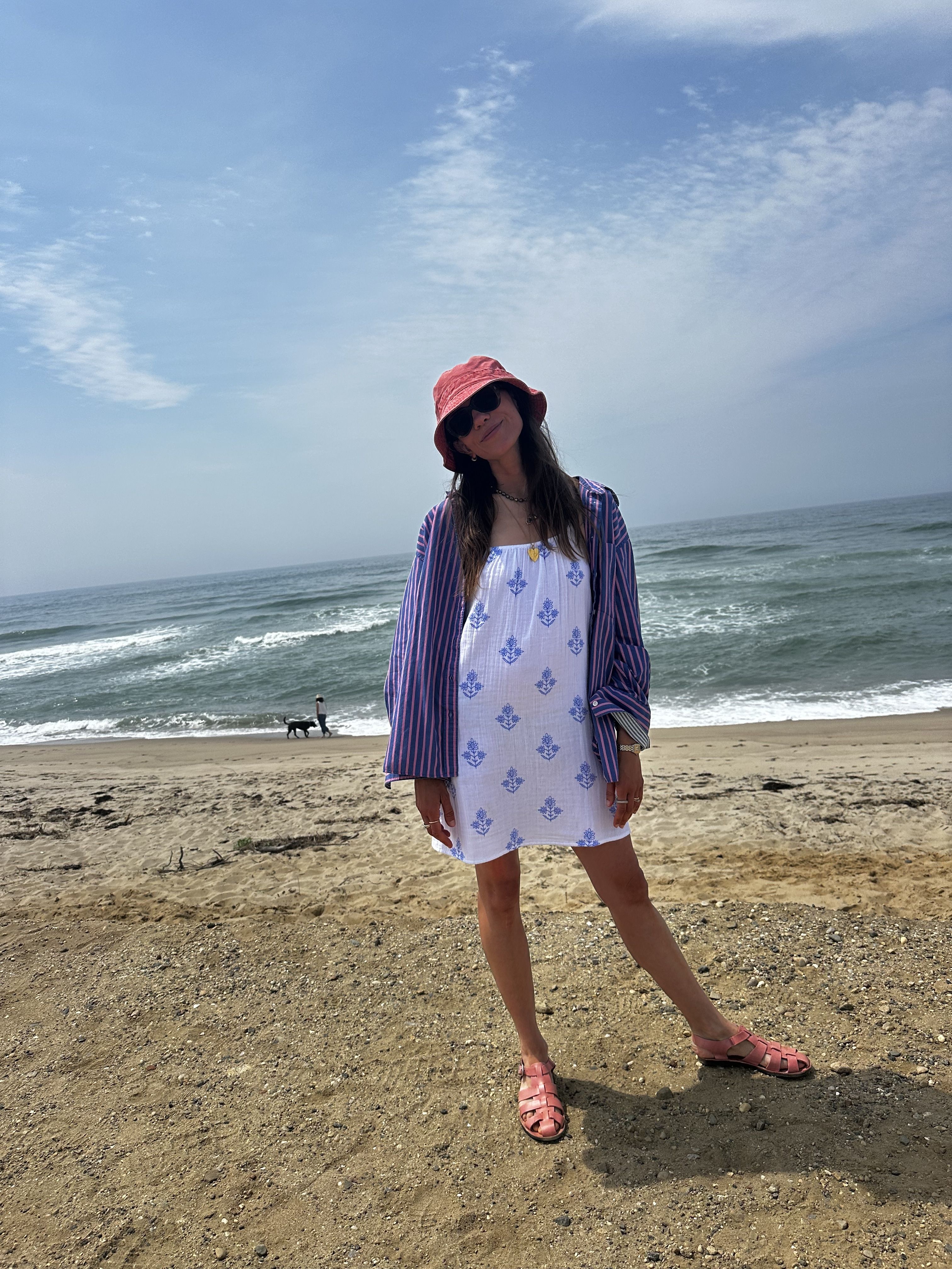 Julia Gall wears a patterned dress coverup and striped shirt