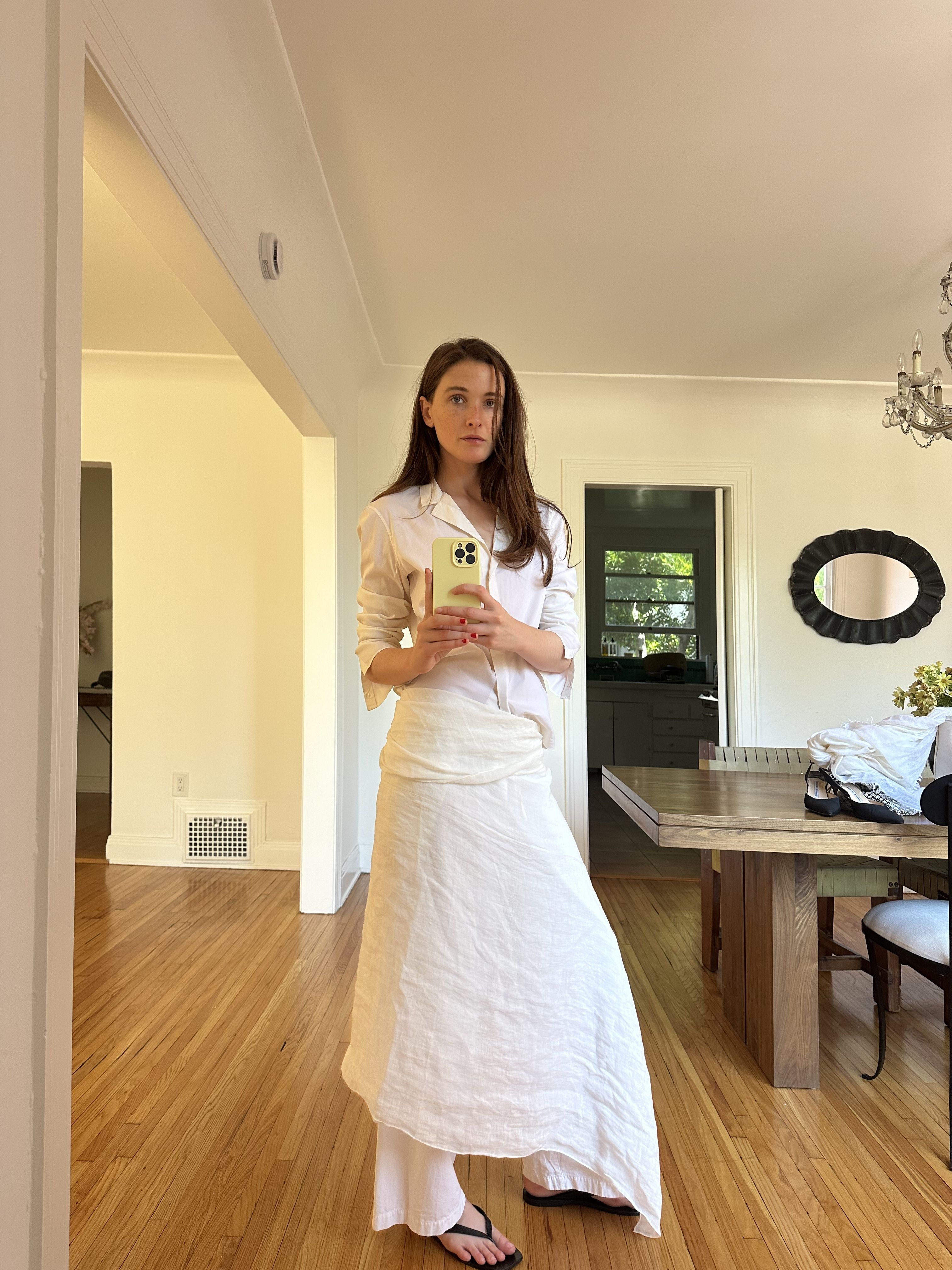 Grace O'Neill Dougherty styles an all-white look including a scarf worn as an oversized sarong