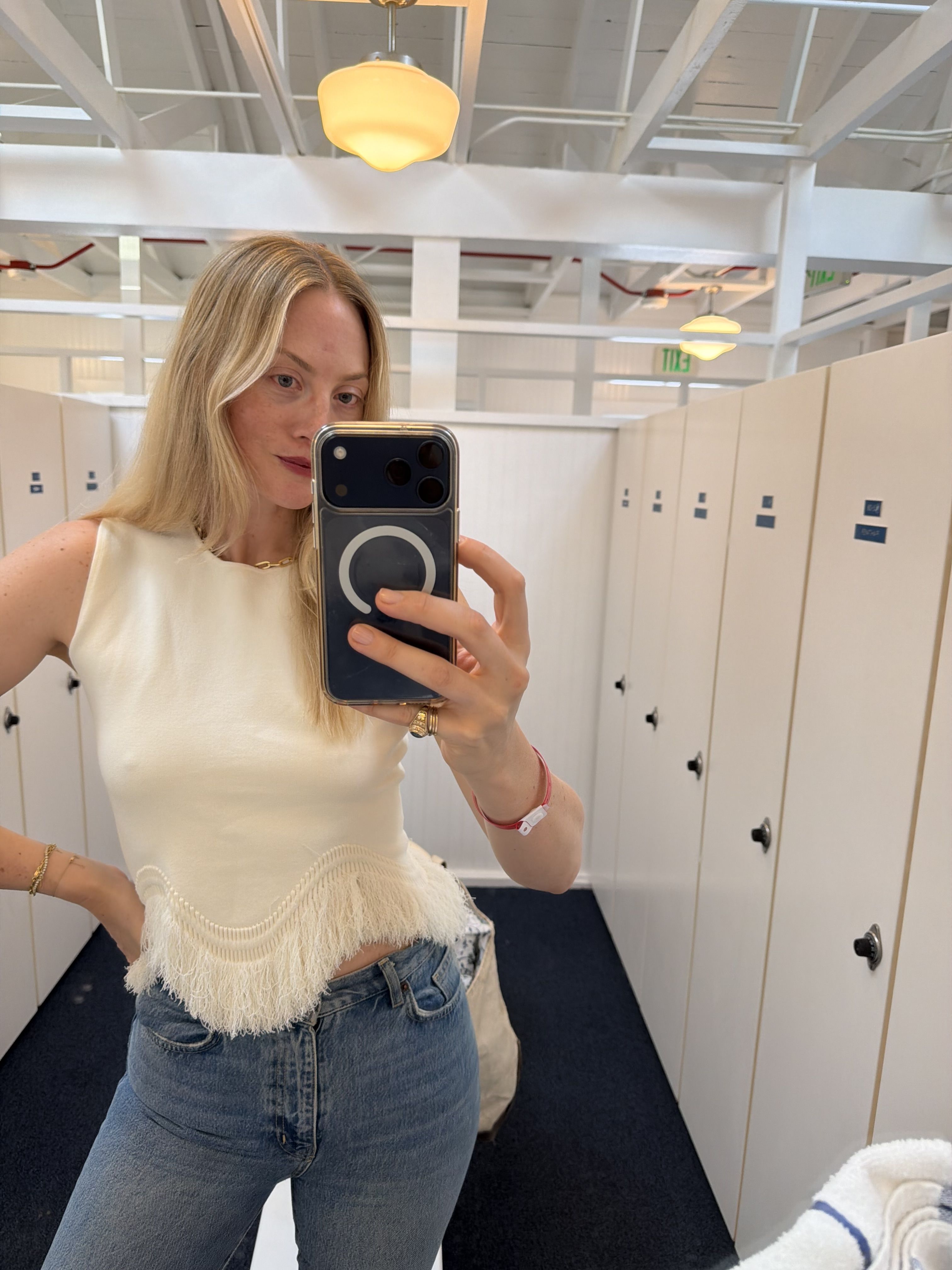 Brooke Ely Danielson styles the top half of a knit set with jeans