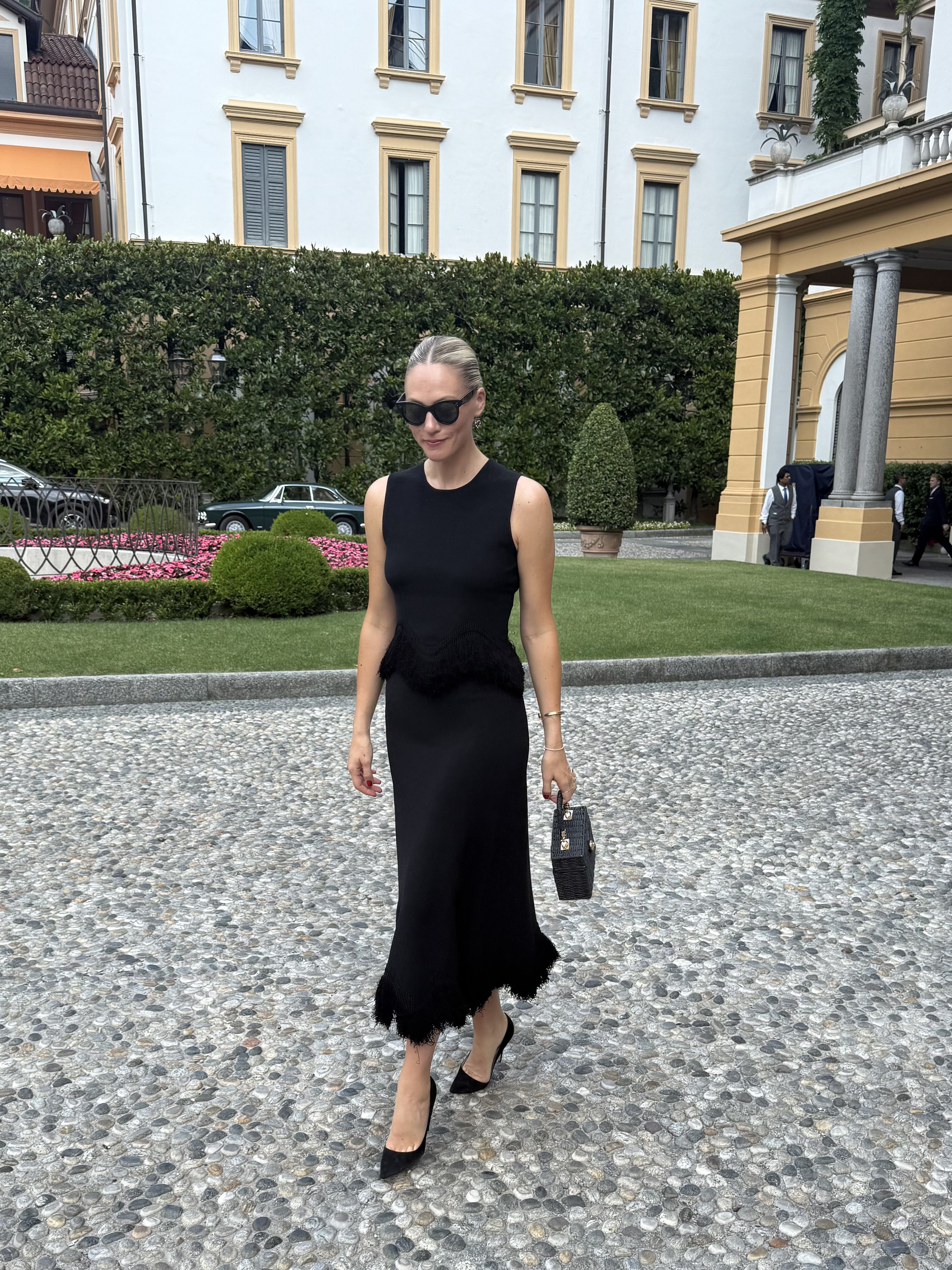 Brooke Ely Danielson models a black knit set while in Lake Como