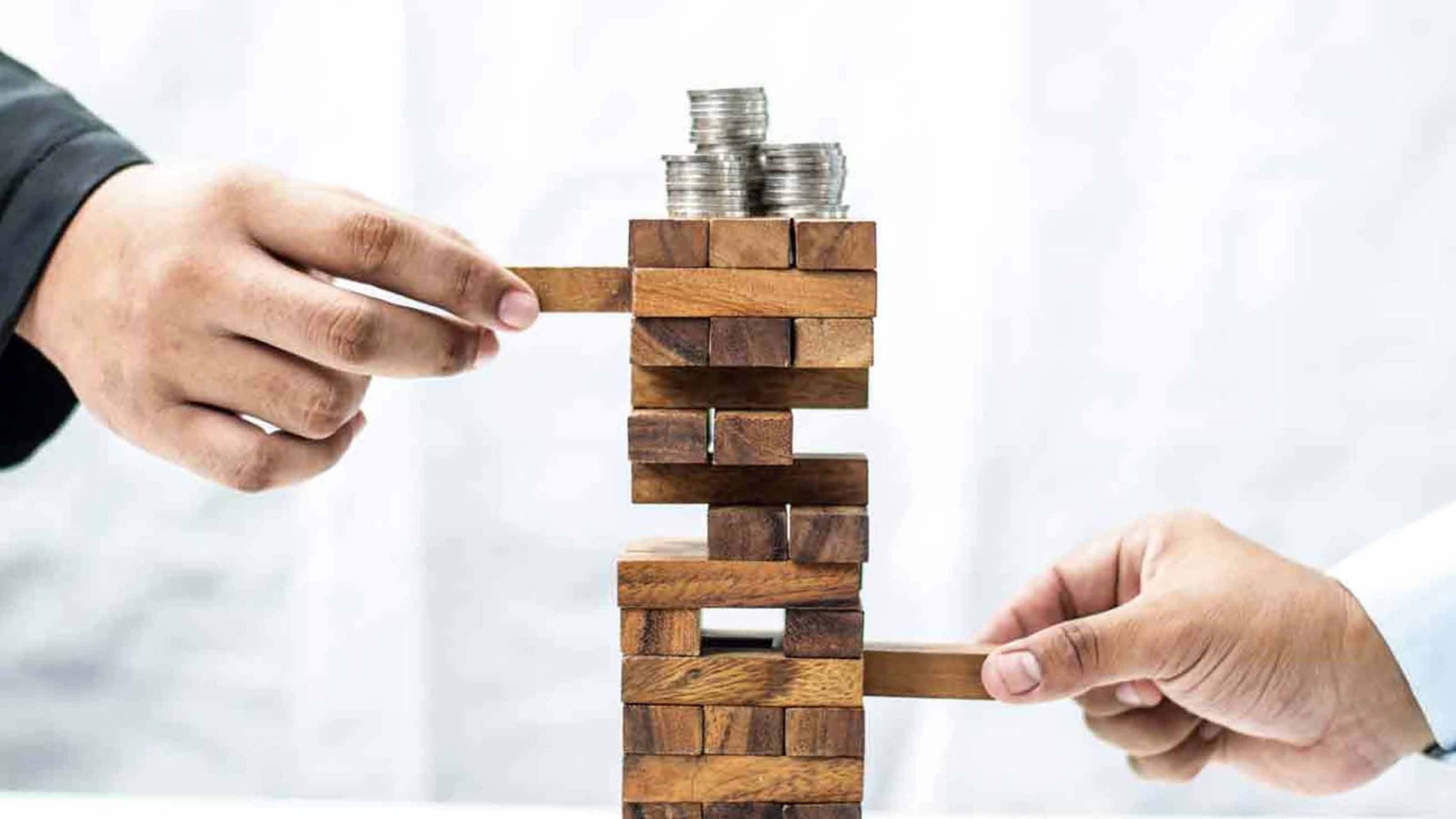 People playing Jenga, representing balance
