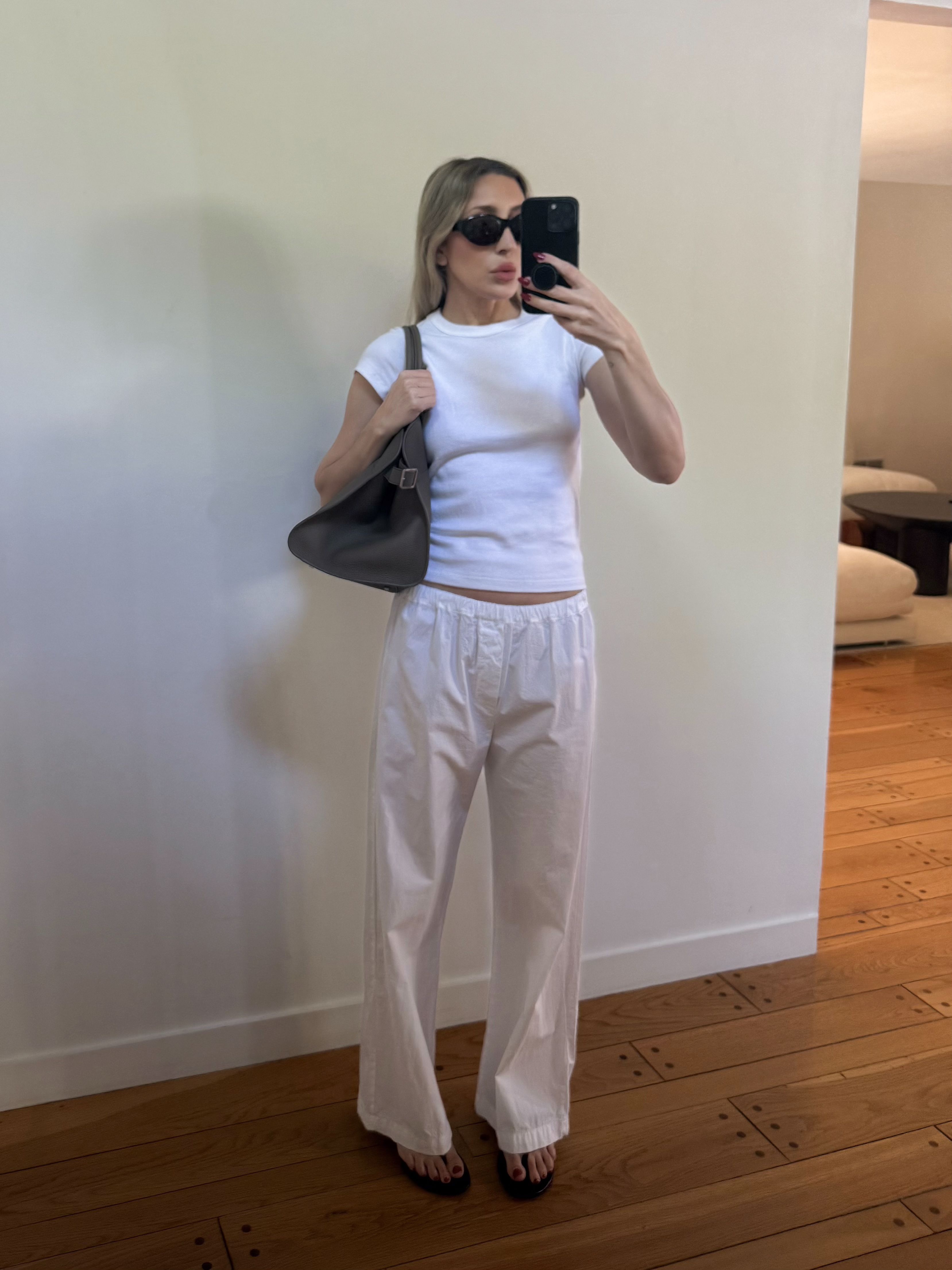 Angela Fink styles an almost all white outfit for summer