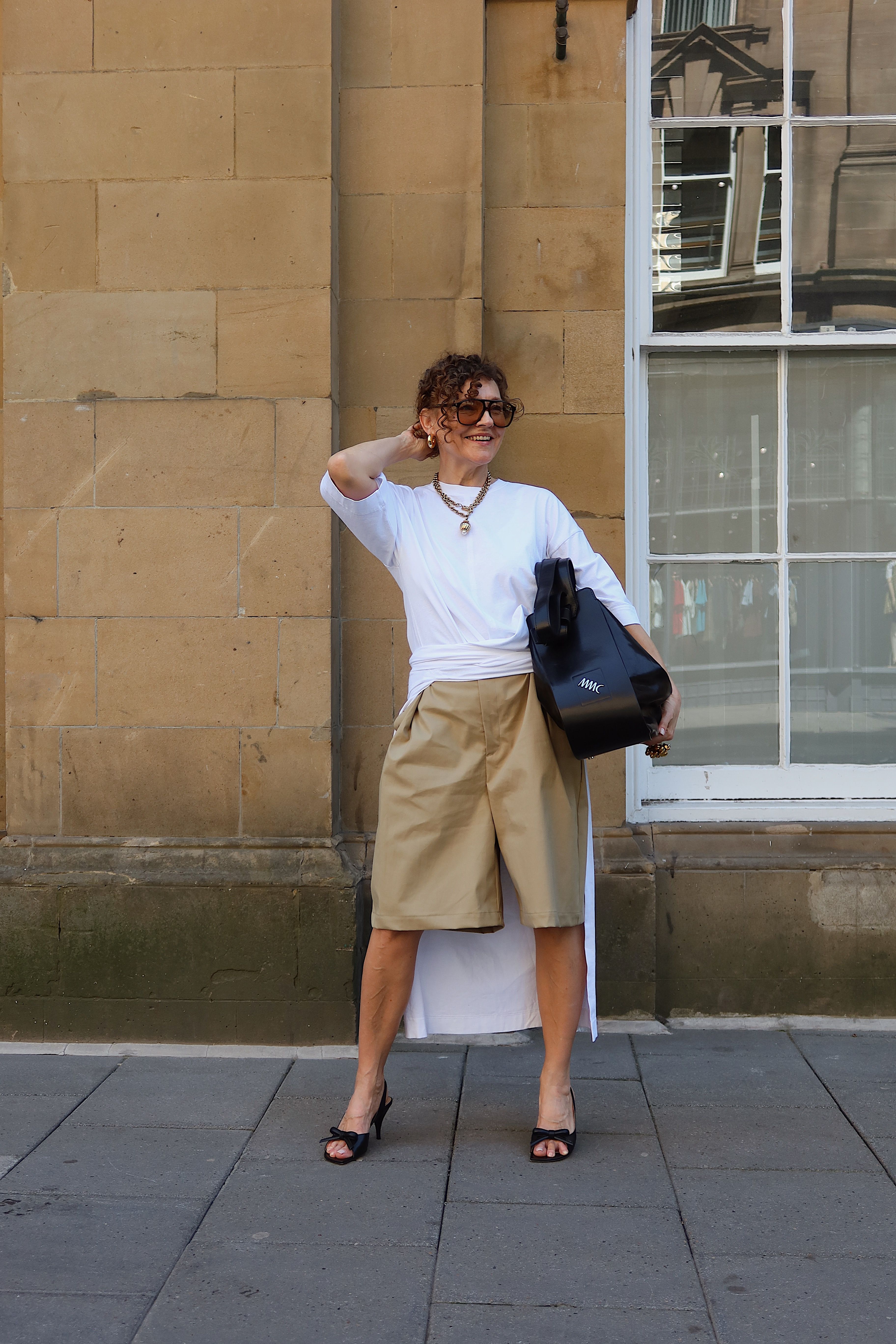 Renia Jazdzyk styles tan bermuda shorts