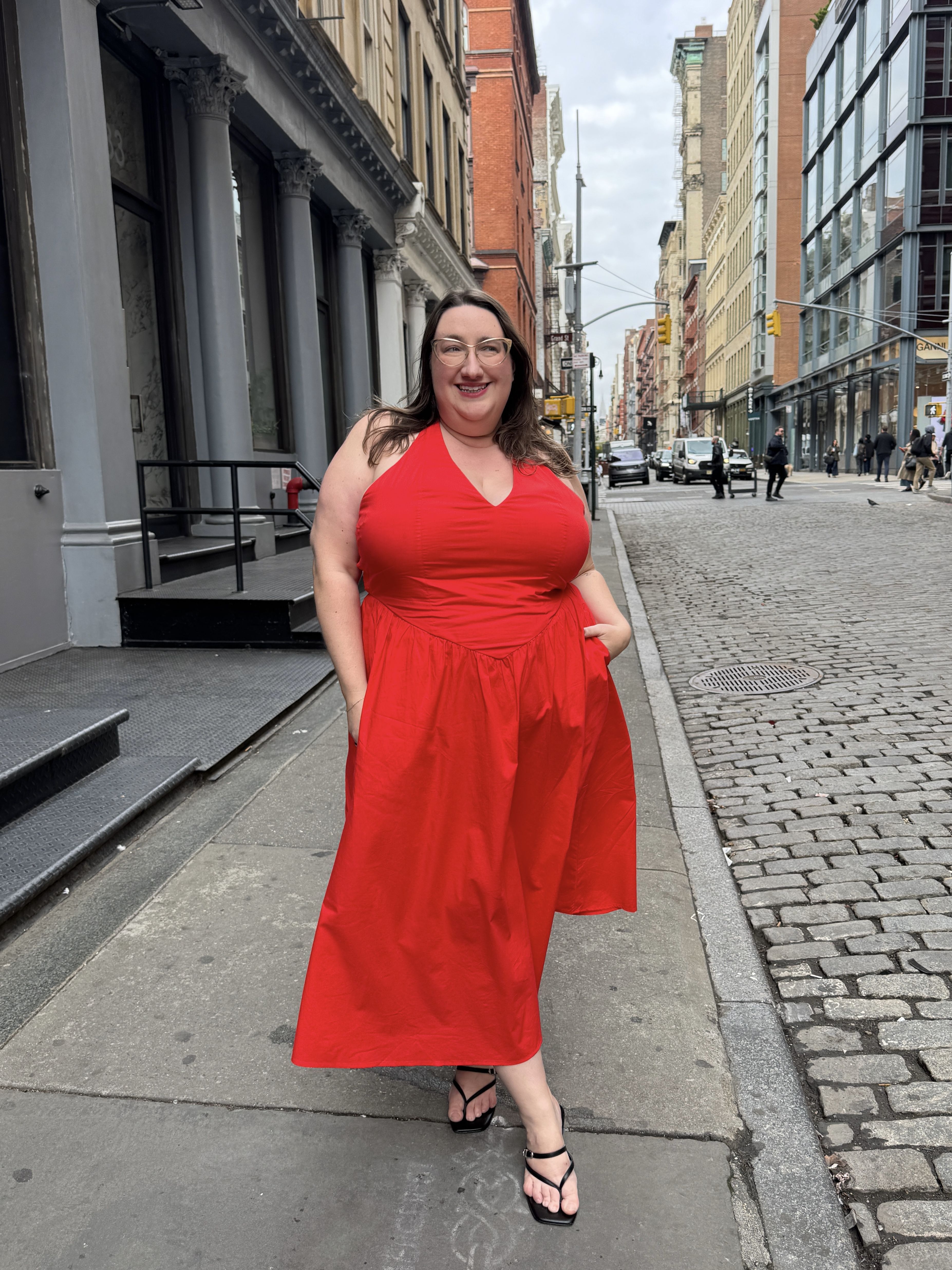 Sarah Chiwaya poses in a "bold red dress" in NYC