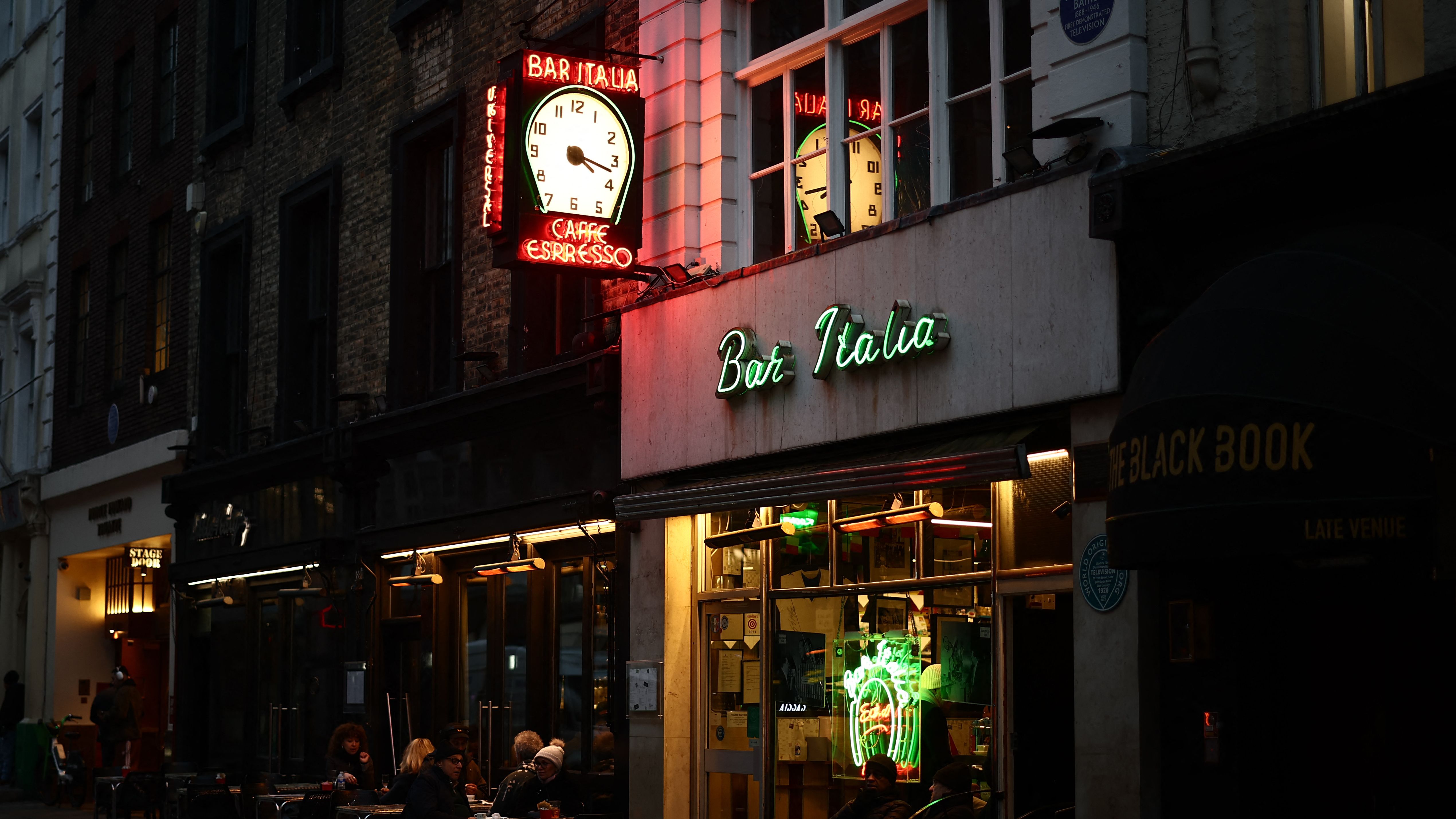 The Bracey family's neon sign for &amp;quot;Bar Italia&amp;quot; is seen above the bar in the Soho district of London