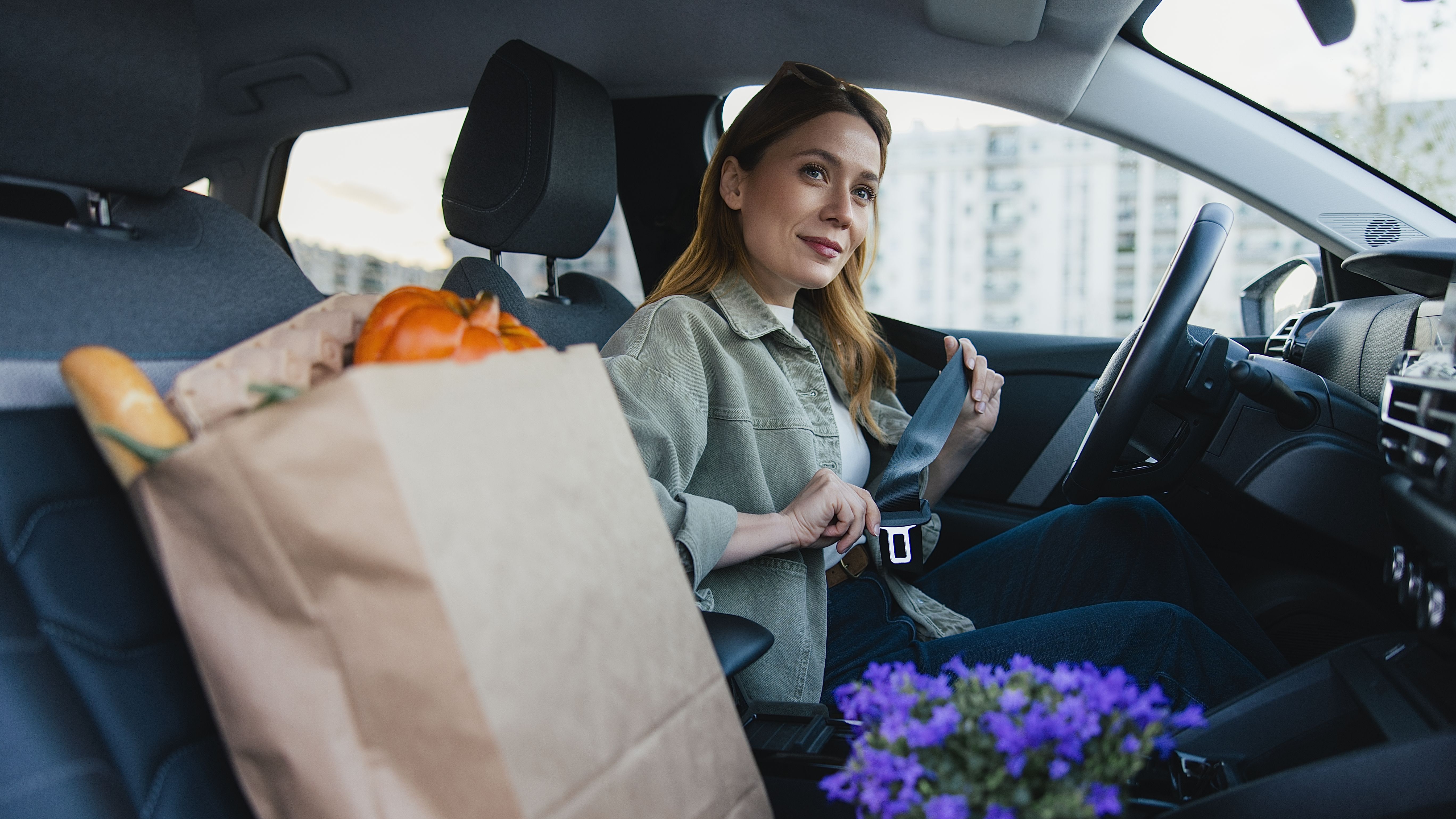 Female Driver Preparing to Drive After Market Shopping Trip
