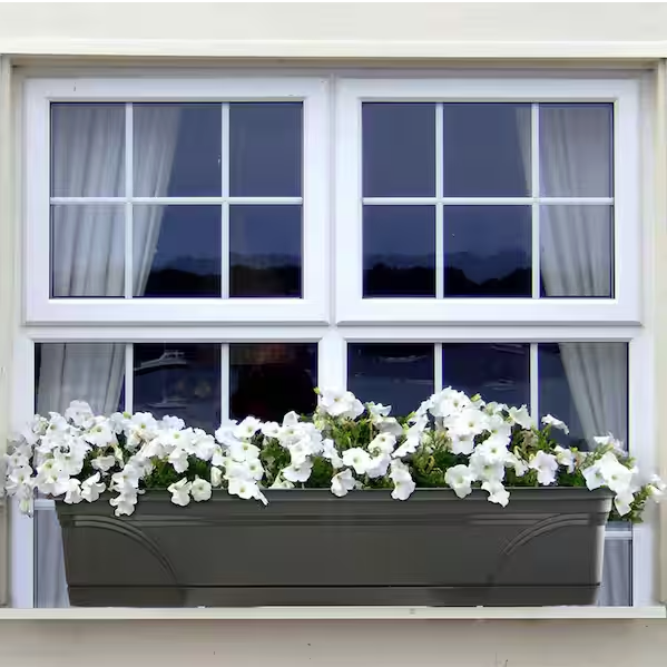 windowsill planter box from Home Depot filled with white flowers