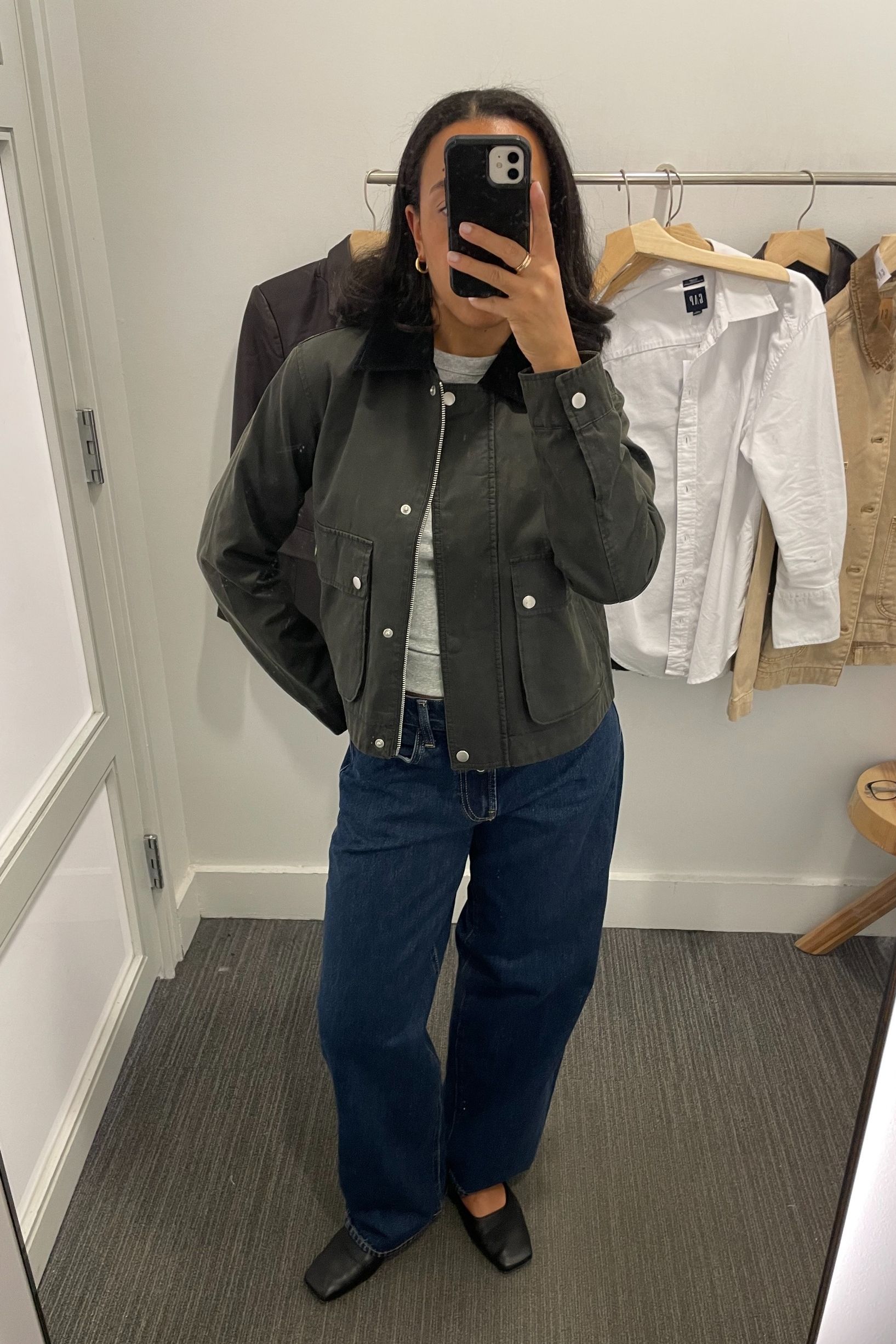 Lauren Tappan wearing a jacket, a tee, and jeans